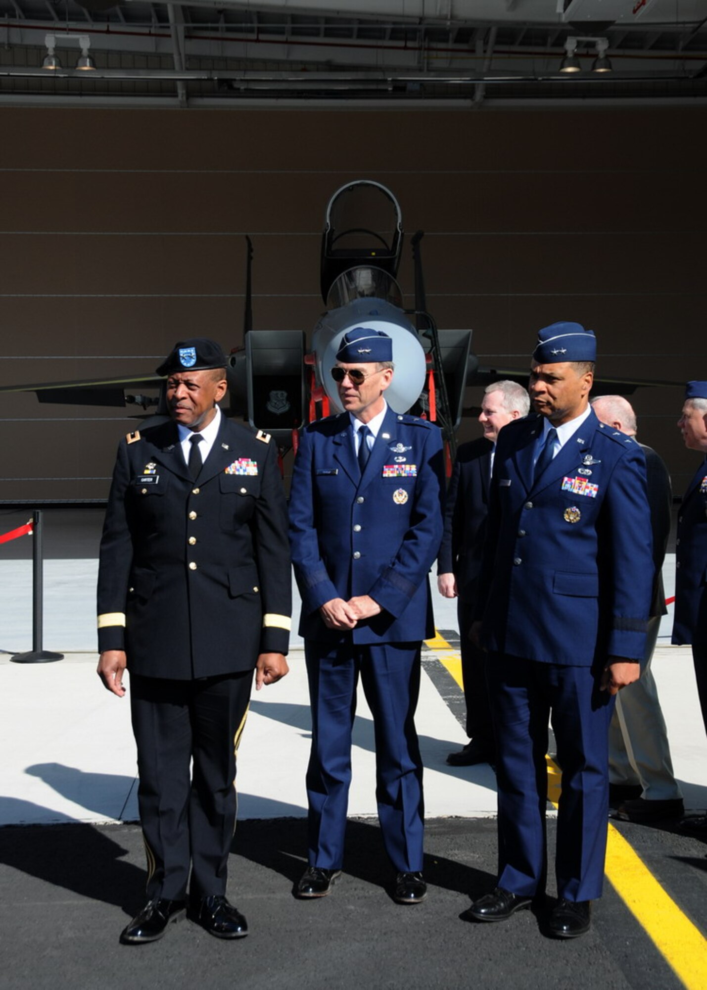 Maj. Gen. Joseph Carter, the MA Adjutant General, Maj. Gen. Patrick Moisio, the Deputy Director of the Air National Guard, and Maj. Gen. Garry Dean, the First Air Force Commander, stand in front of the new Air Sovereignty Alert hangar at the 104th Fighter Wing, Massachusetts Air National Guard base in Westfield Massachusetts on April 10, 2010 just after the official ribbon cutting ceremony.  The wing officially accepted the alert mission on February 15, 2010, and stands ready to defend the homeland if called upon.  (photograph by Senior Master Sgt. Robert J. Sabonis)