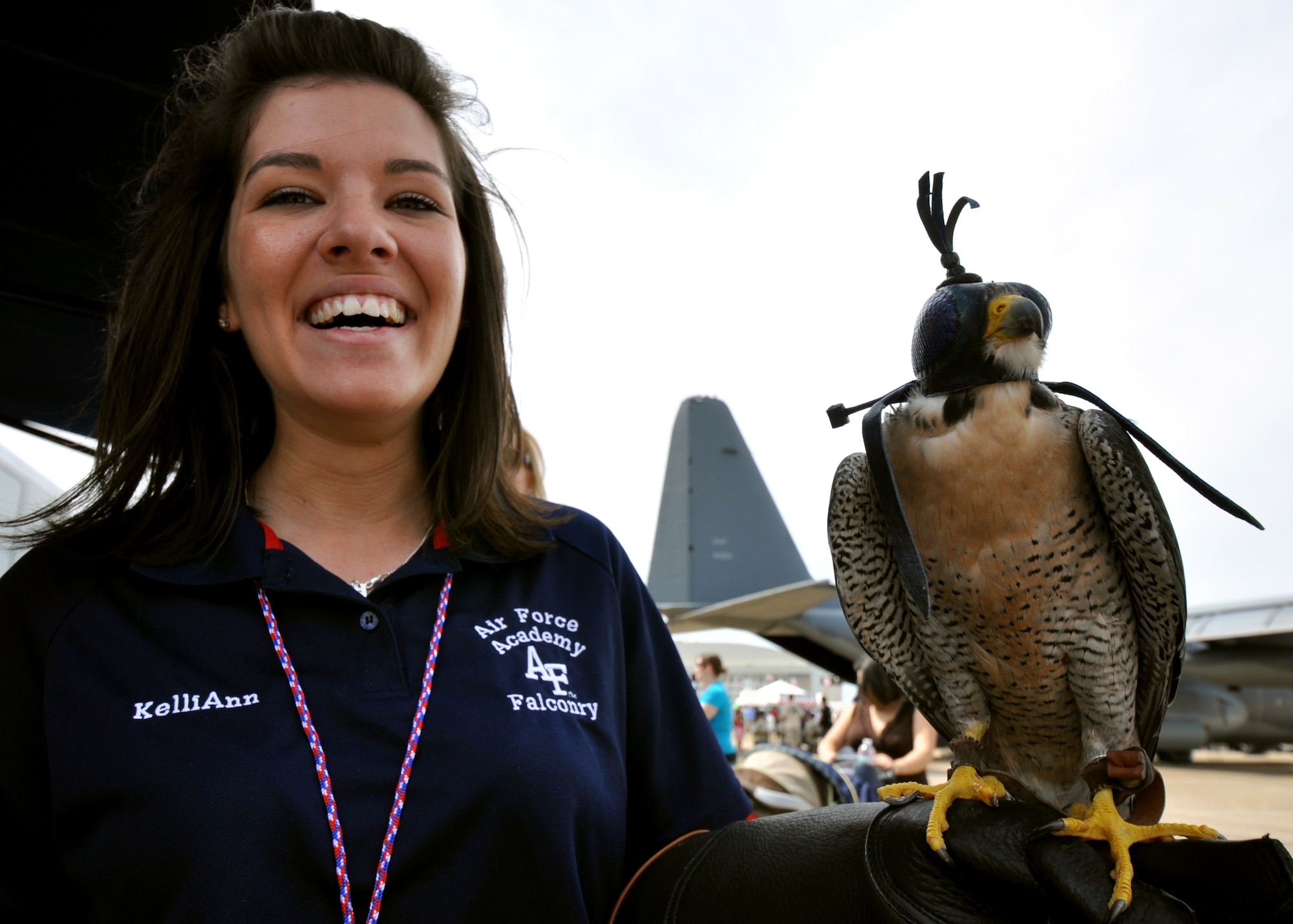 Danielle Cortez holds the U.S. Air Force Academy falcon Havoc, during the Eglin 75th Anniversary Air Show April 10.  More than 125,000 were in attendance April 10-11, enjoying a variety of aerial performances and static displays. This was Eglin’s first open house since 2007 and was timed to coincide with the 75th anniversary of the installation. The Thunderbirds, Army Black Daggers, an F-22A Raptor demo and "Tora, Tora, Tora" were some of the highlights of the event. (U.S. Air Force photo/Airman 1st Class Anthony Jennings.) 