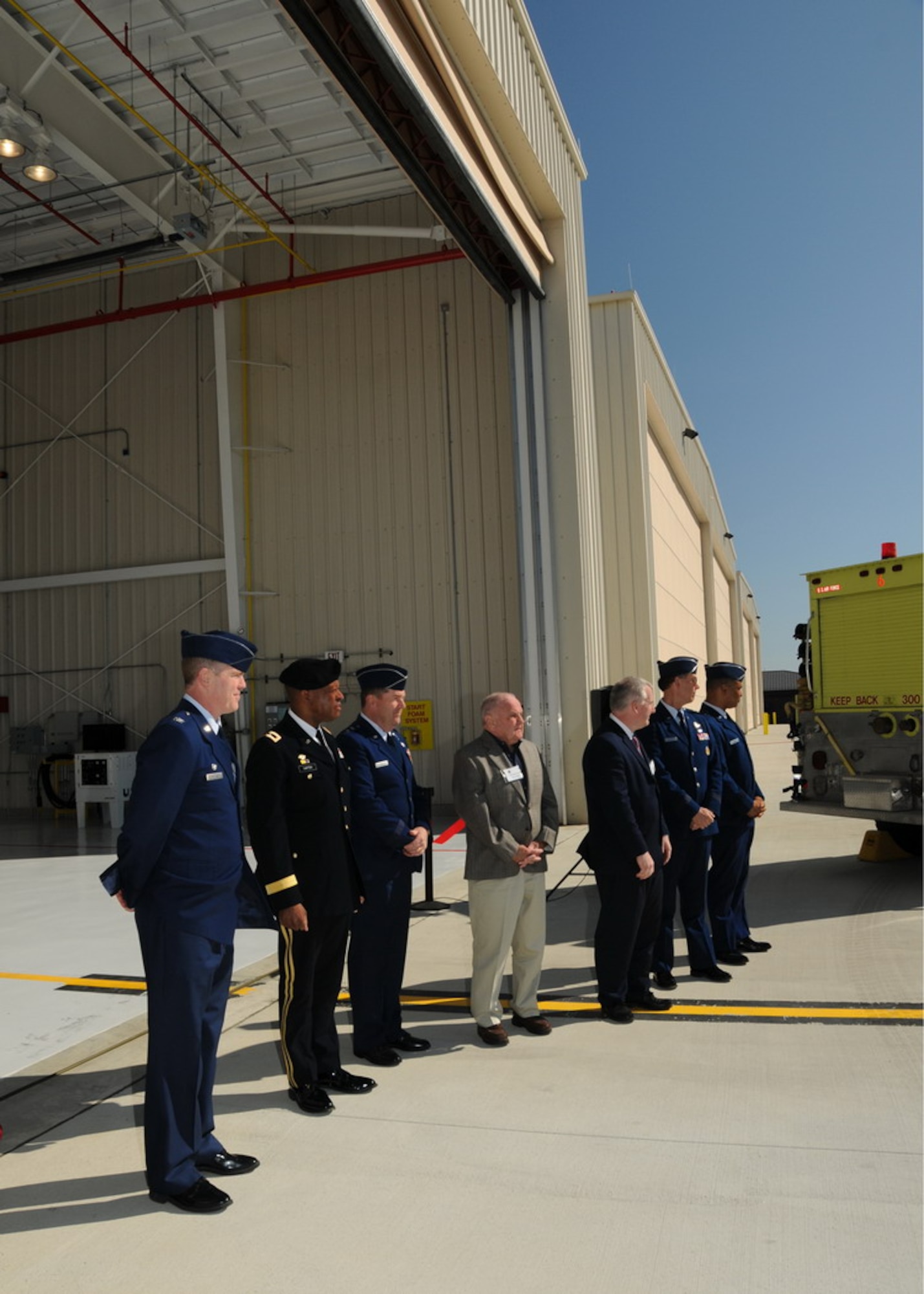 Commanders stand in front of the new Air Sovereignty Alert hangars at the 104th Fighter Wing, Massachusetts Air National Guard base in Westfield Massachusetts on April 10, 2010 just after the official ribbon cutting ceremony.  The wing officially accepted the alert mission on February 15, 2010, and stands ready to defend the homeland if called upon.  (photograph by Senior Master Sgt. Robert J. Sabonis)