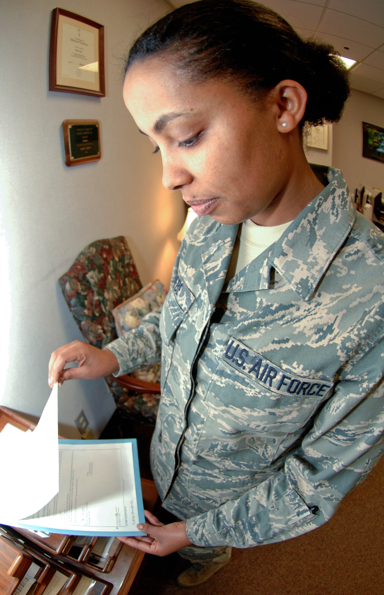 Senior Airman Bethanya Abebe, 22nd Mission Support Group knowledge operations manager, inspects an outgoing correspondence package before it is delivered to one of six squadrons within the 22nd MSG April 9, 2010, McConnell Air Force Base, Kan.  In addition to her normal duties, Airman Abebe is the functional area records manager, Privacy Act and Freedom of Information Act monitor for the 22nd Security Forces Squadron and the Air Force Portal content manger for McConnell.  Though she was born and raised in Ethiopia, she calls Seattle, Wash., home.  (U.S. Air Force photo/ Senior Airman Abigail Klein)