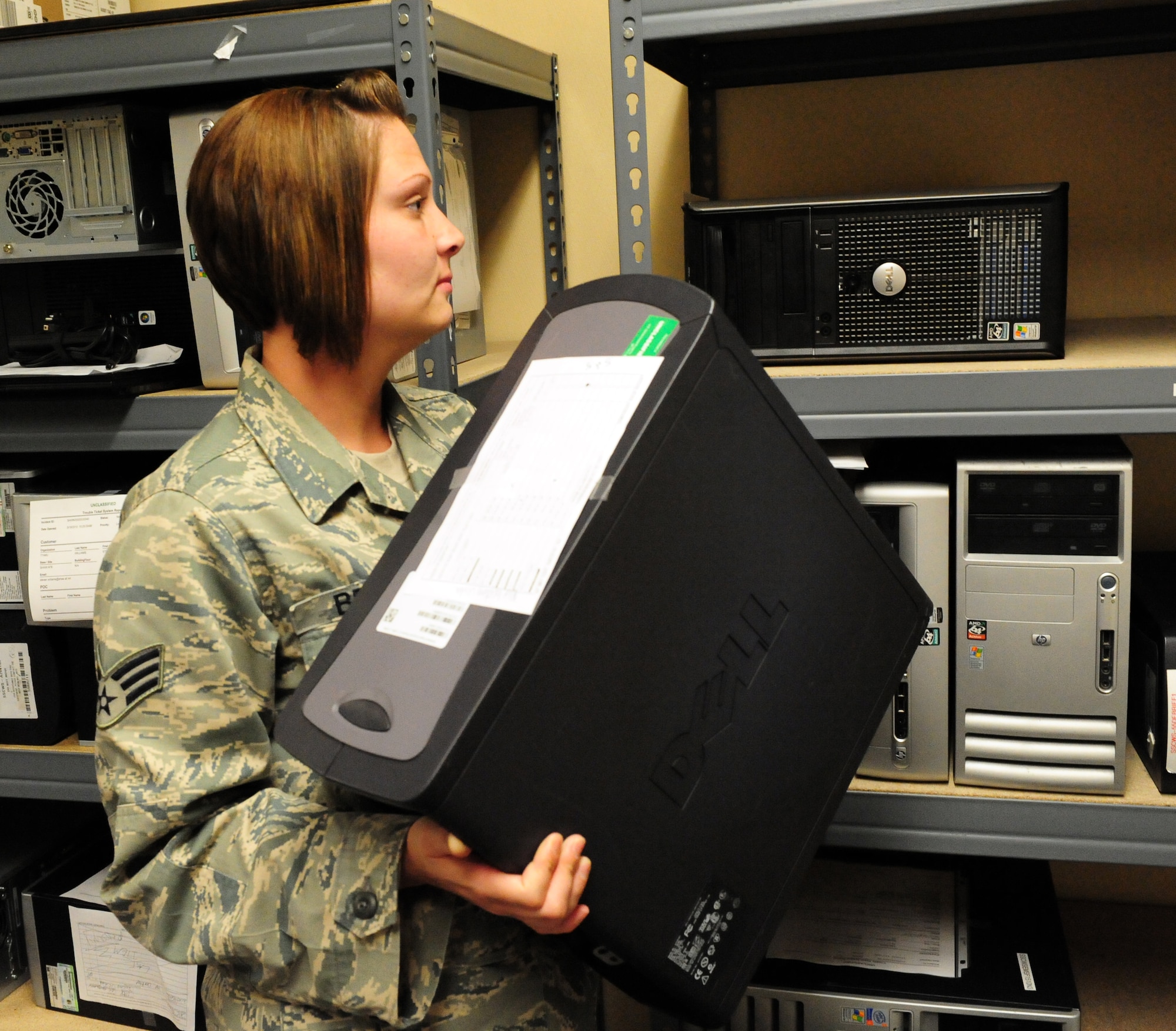 100409-F-6838W-019
SHAW AIR FORCE BASE, S.C. -- Senior Airman Jennifer Britt, places a computer work station on a rack Apr. 9, 2010. The Client Service Center supports customers with a wide variety of computer and communication troubleshooting issues. (U.S. Air Force photo/Airman 1st Class Neil D. Warner)