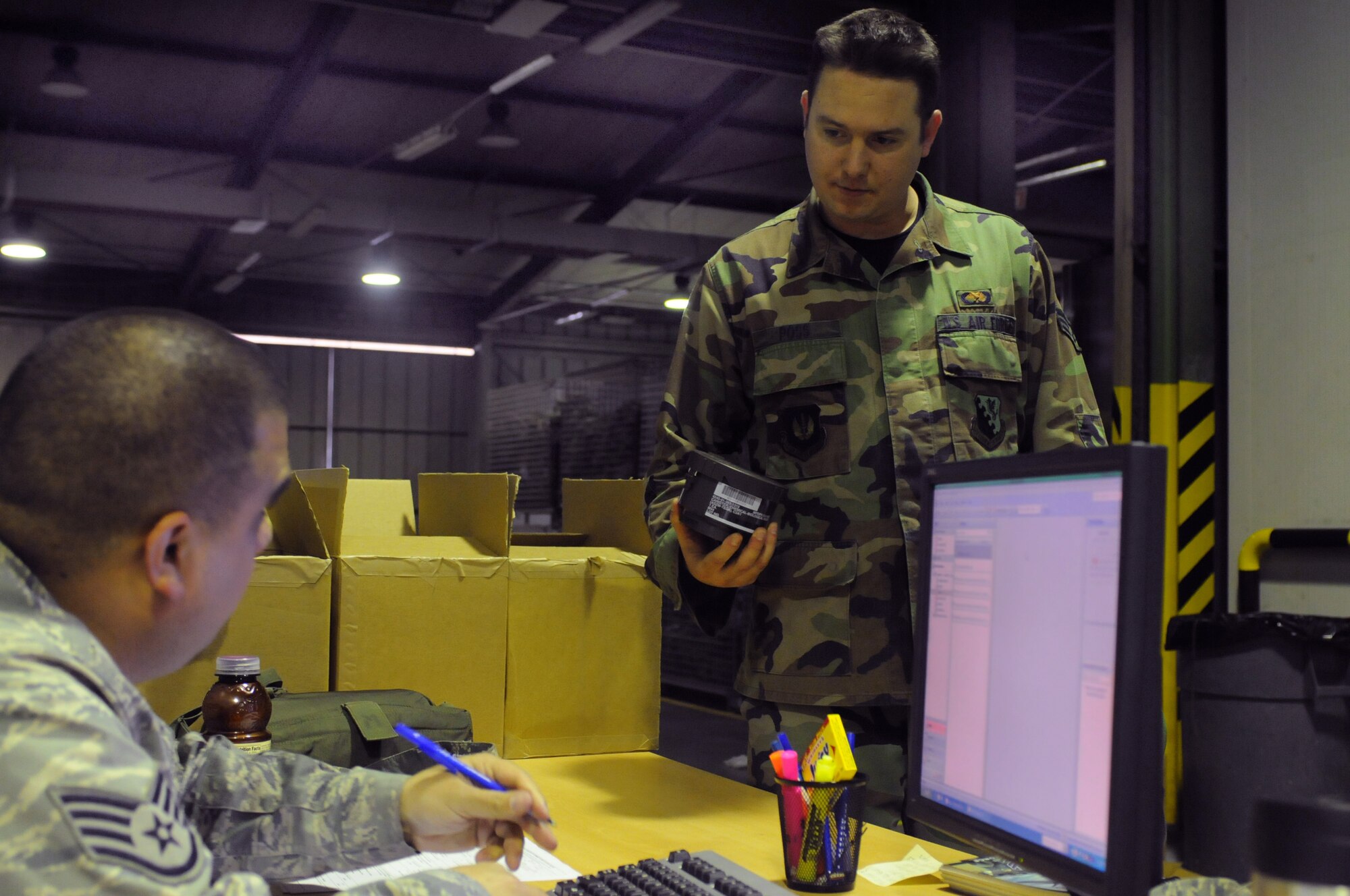 Senior Airman Dan Poss, 31st Aircraft Maintenance Squadron, receives a gas mask canister from the supply flight, April 12, as part of his deployment out-processing checklist, Aviano Air Base, Italy. Airman Poss will be deploying to Southwest Asia.
(U.S. Air Force photo/Staff Sgt. Nadine Y. Barclay)