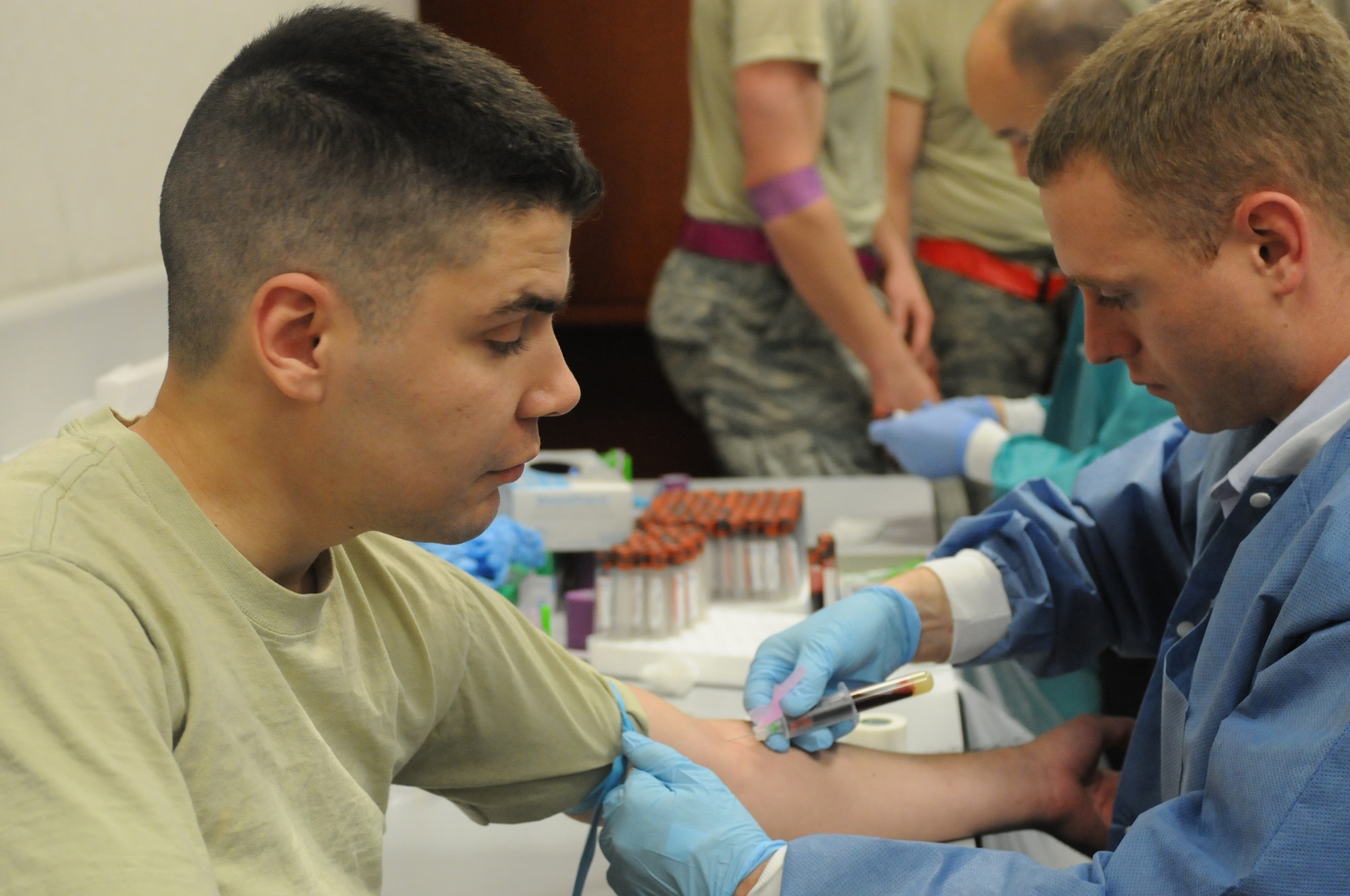 Staff Sgt. Christopher Castro, 510th Fighter Squadron, avionics specialist, patiently Staff Sgt. Christopher Castro, 510th Fighter Squadron avionics specialist, waits for a vial of blood to fill during a mass out-processing deployment line, April 12,  Aviano Air Base, Italy. Sergeant Castro will be deploying to Southwest Asia.
(U.S. Air Force photo/Staff Sgt. Nadine Y. Barclay)