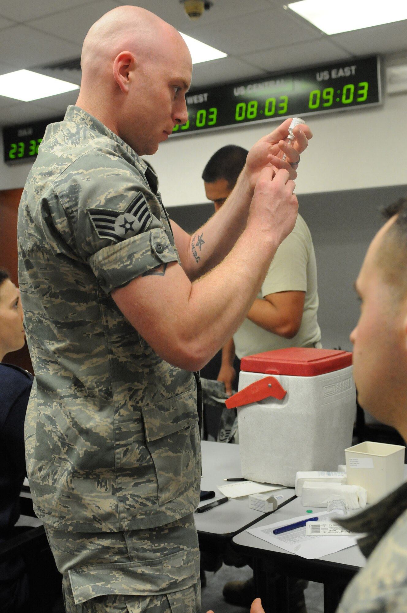 Staff Sgt. Christian Baldwin, 31st Medical Operations Squadron immunizations technician, prepares to administer typhoid, small pox and hepatitis shots to Airmen deploying, Aviano Air Base, Italy. Members from various squadrons deploying in support of the 510th Fighter Squadron were briefed by base agencies, received immunizations, and were issued mandatory equipment during a deployment outprocessing mobility line.
(U.S. Air Force photo/Staff Sgt. Nadine Y. Barclay)