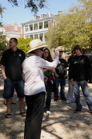 Fran Bennett guides members from Joint Team Charleston through the Newcomer?s Tour in downtown Charleston, S.C., April 1, 2010. The tour is open to service members and their families to spend the day sightseeing and getting a taste of Charleston. Throughout the day the tour passes through one of America?s first and most historical neighborhoods. When a devastating earthquake rocked Charleston in 1886, the city was too poor to tear down and rebuild its structures due to the Civil War. Therefore, Charleston?s authenticity and charm was maintained through a series of repairs to the already existing architecture of the buildings which date back to the 1700s. (U.S. Air Force Photo/Airman 1st Class Lauren Main)