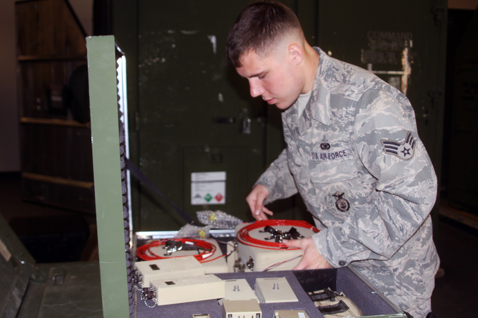 WRIGHT-PATTERSON AIR FORC BASE, Ohio – Senior Airman James Coffey, 445th Security Forces Squadron, inventories equipment March 28 for an upcoming mobility exercise the wing will be participating in. (U.S. Air Force photo/Senior Airman Mikhail Berlin) 