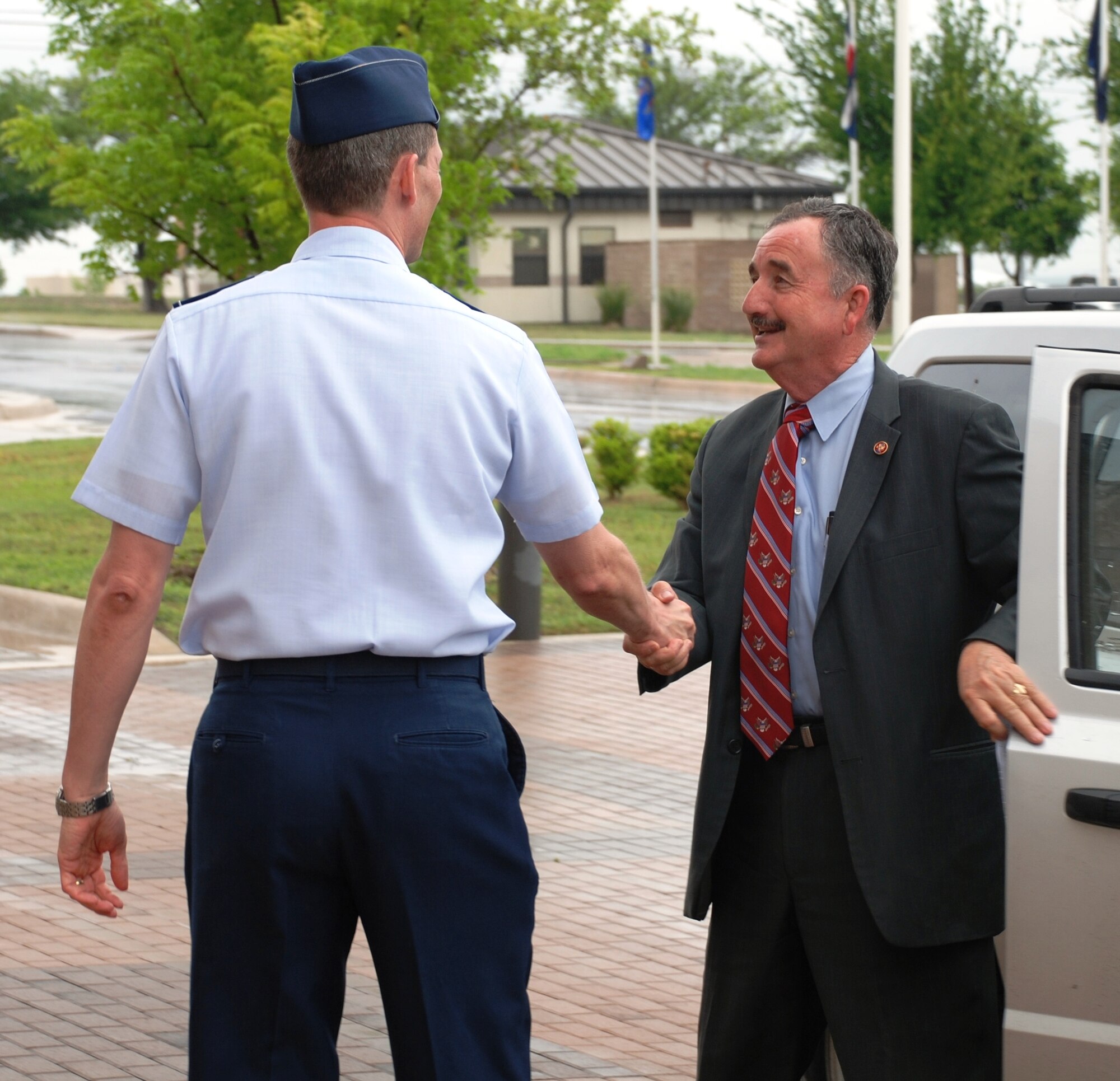 LAUGHLIN AIR FORCE BASE, Texas – U.S. Rep. Ciro Rodriguez is greeted by Col. Jeffrey McDaniels, 47th Flying Training Wing commander, upon his arrival at Laughlin April 12. Congressman Rodriguez visited Laughlin in order to observe some of the base’s ongoing stimulus-funded projects. (U.S. Air Force photo by Airman 1st Class Blake Mize) 