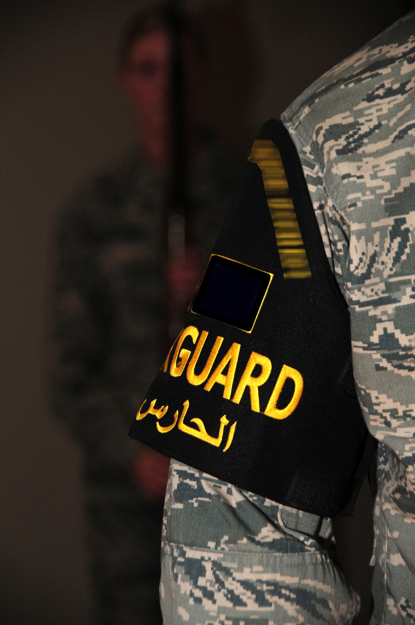 SOUTHWEST ASIA -- Right, U.S. Air Force Senior Airman Alston Leslie,  386th Air Expeditionary Wing Honor Guard head trainer, instructs team members on rifle techniques during a routine practice here April 6, 2010 at an air base in Southwest Asia. The base honor guard participates in several ceremonies weekly, to include change of command and promotion ceremonies.  (U.S. Air Force photo by Staff Sgt. Lakisha A. Croley/Released)