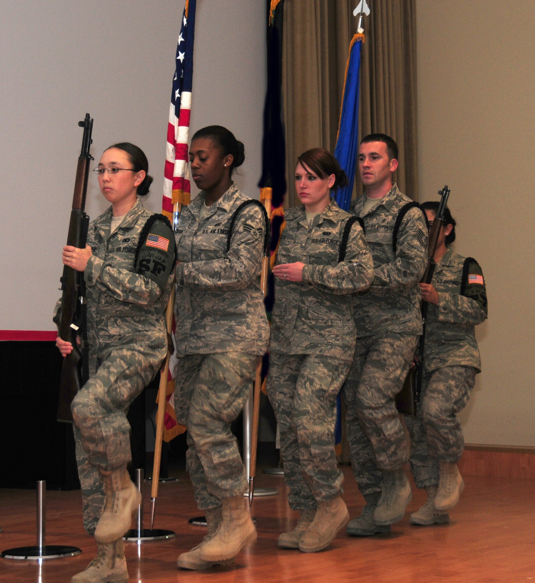 SOUTHWEST ASIA -- From left, 386th Air Expeditionary Wing Honor Guard members U.S. Air Force Senior Airman Kelly Clevenger, Senior Airman Cornelia Jackson, Senior Airman Paul Mallory, Tech. Sgt. Kevin Bull and Airman 1st Class Sary Gomez, rehearse "presenting the colors" during a routine practice here April 6, 2010 at a an air base in Southwest Asia. The base honor guard participates in several ceremonies weekly, to include change of command and promotion ceremonies.  (U.S. Air Force photo by Staff Sgt. Lakisha A. Croley/Released)