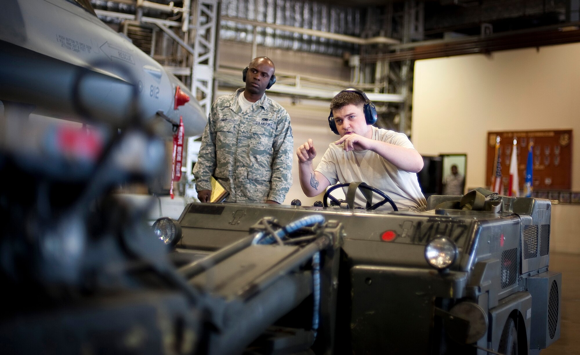 MISAWA AIR BASE, Japan -- Senior Airman Justin Boatright, 14th Aircraft Maintenance Unit load crew member, helps his teammate?s align a GBU-31 joint direct attack munition during a load crew competition Apr. 9. The 14th AMU was last year's reigning champions. (U.S. Air Force photo/Staff Sgt. Chad C. Strohmeyer)