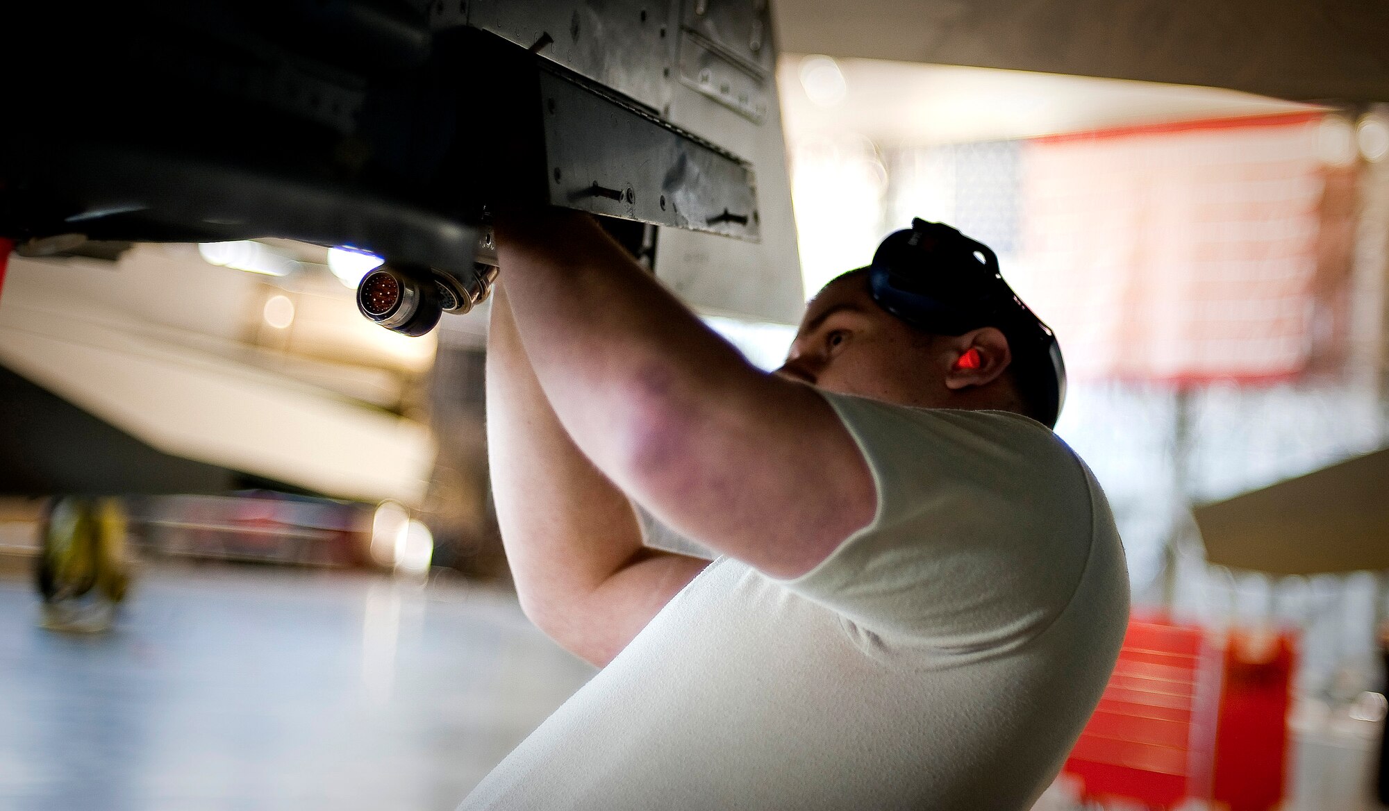 MISAWA AIR BASE, Japan -- Senior Airman David Gondek, 14th Aircraft Maintenance Unit load crew member, prepares an F-16 Fighting Falcon for munitions during a load crew competition Apr. 9. Airman Gondek's role was to prepare the aircraft before munitions were loaded. (U.S. Air Force photo/Staff Sgt. Chad C. Strohmeyer)