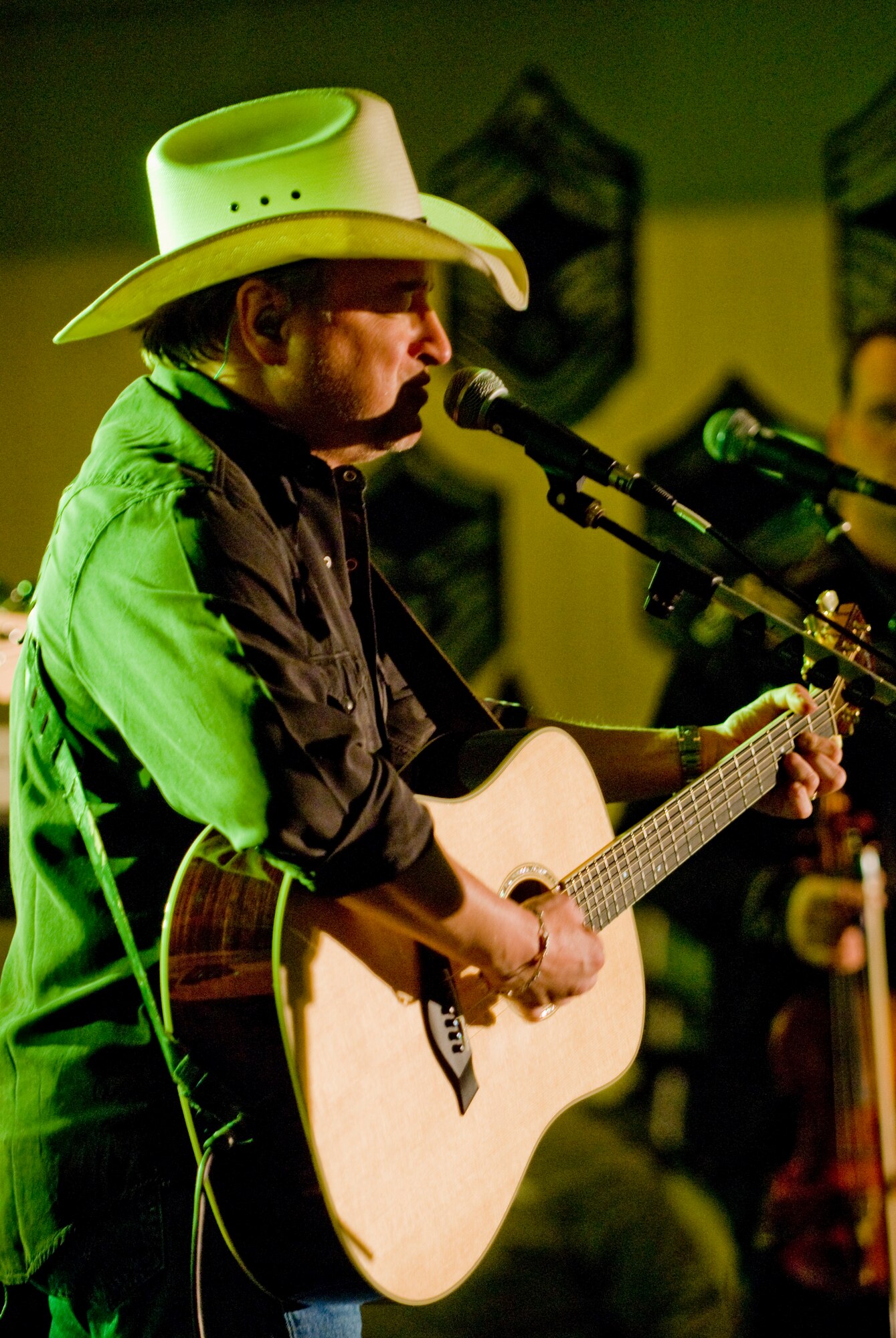 KUNSAN AIR BASE, Republic of Korea -- Country singer Mark Chesnutt plays one of his songs to the crowd April 10. Mark Chesnutt met with members of the Wolf Pack and put on a show in celebration of the end of the Wolf Pack Unit Compliance Inspection. (U.S. Air Force photo/Senior Airman Jonathan Steffen) 