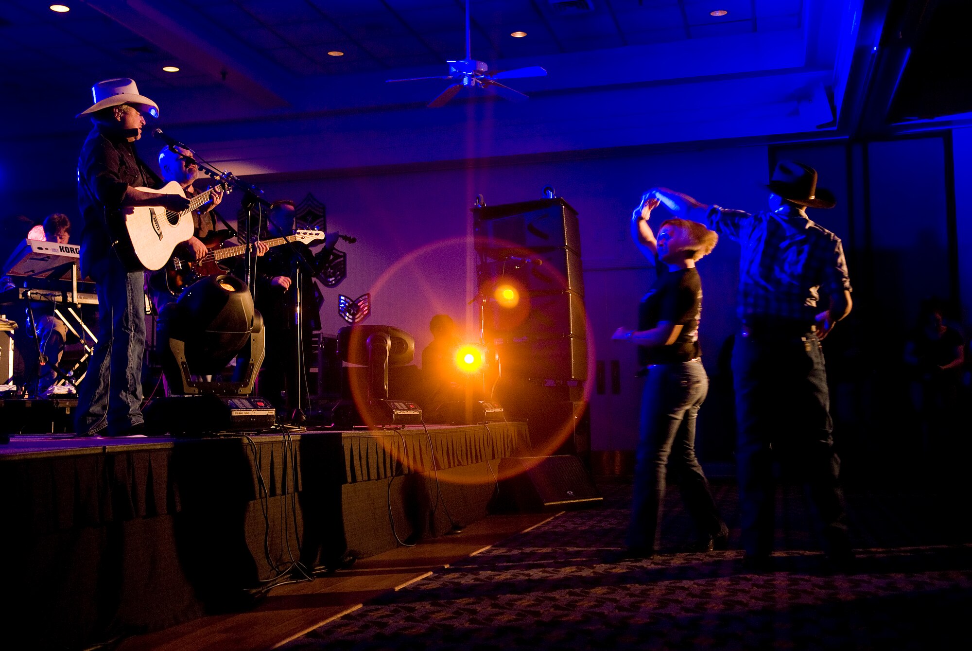KUNSAN AIR BASE, Republic of Korea -- Country singer Mark Chesnutt sings to Wolf Pack Airmen April 10. Mark Chesnutt traveled to Kunsan to meet with members of the Wolf Pack and to put on a show in celebration of the end of the Wolf Pack Unit Compliance Inspection. (U.S. Air Force photo/Senior Airman Jonathan Steffen) 