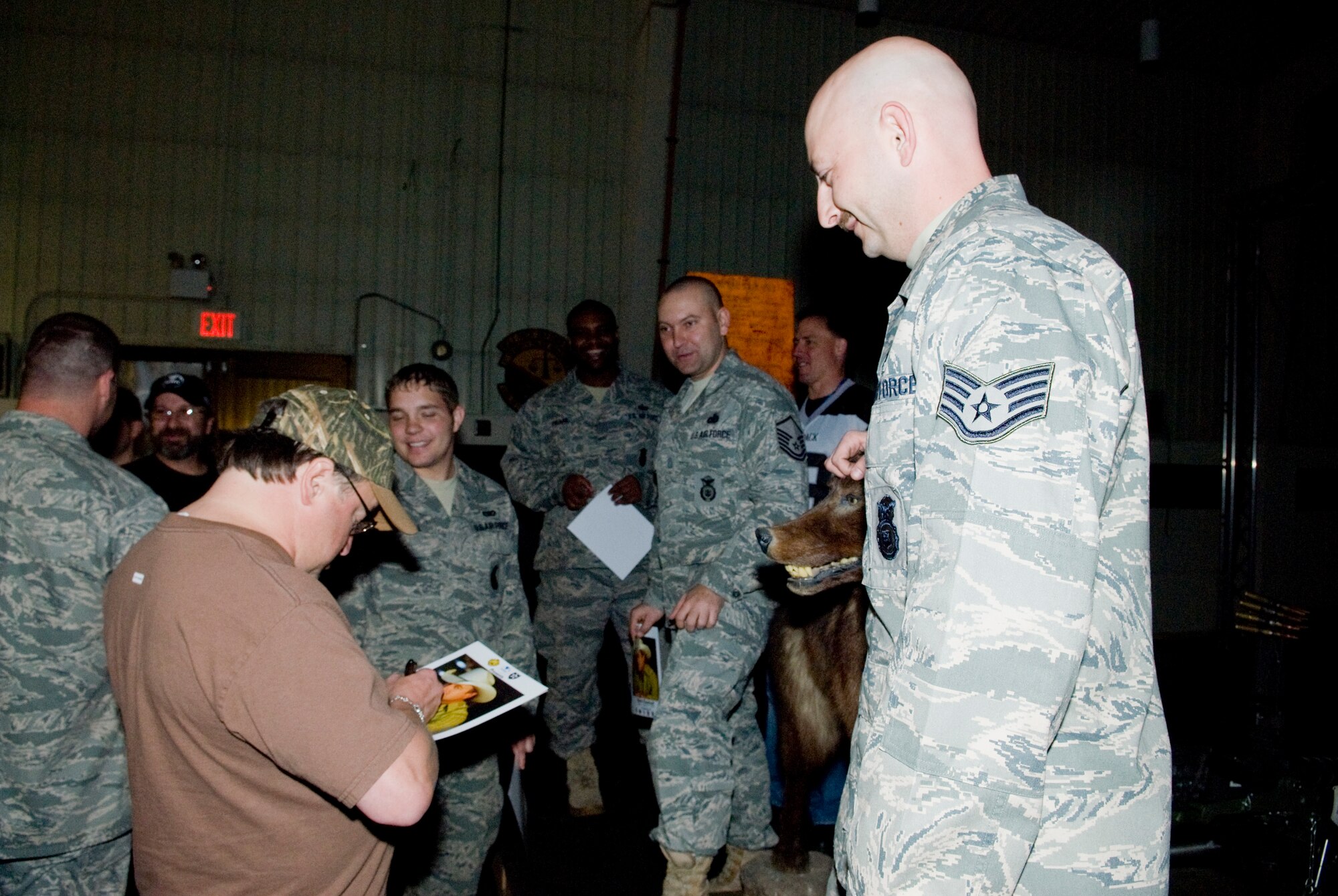 KUNSAN AIR BASE, Republic of Korea -- Country singer Mark Chesnutt signs an autograph for Staff Sgt. William Waidner, 8th Security Forces Squadron, April 10.  Mark Chesnutt met with members of the Wolf Pack and put on a show in celebration of the end of the Wolf Pack Unit Compliance Inspection. (U.S. Air Force photo/Senior Airman Jonathan Steffen) 