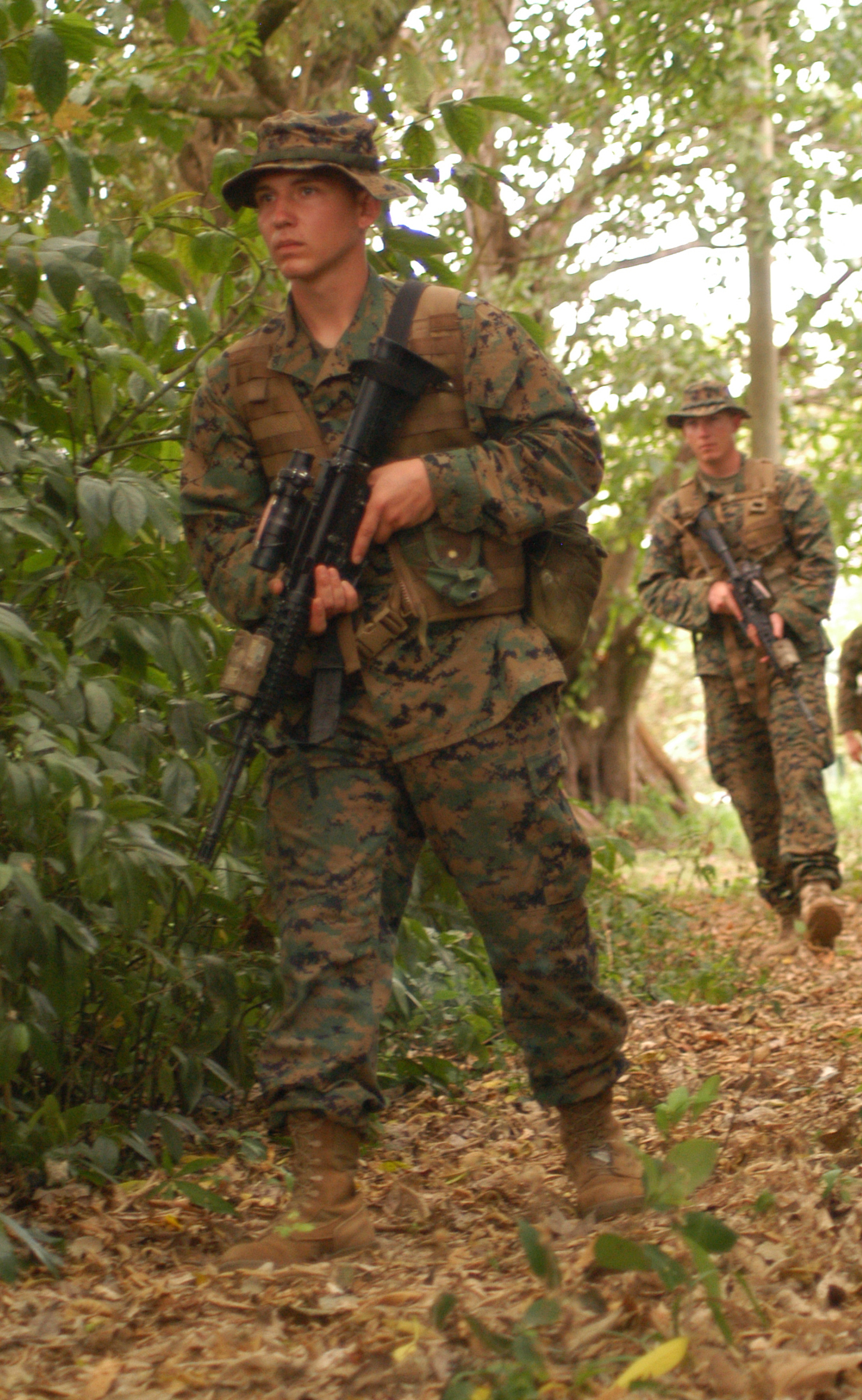 Lance Cpl. Jared Michaels, a machine gunner, Company F, 2nd Battalion, 23rd Marine Regiment, takes the point man position during a mock-patrol following a classroom portion of Belize Defense Force jungle warfare tactics training during Tradewinds '10, a Chairman of the Joint Chiefs directed, U.S. Southern Command sponsored annual exercise that is conducted with Caribbean Basin Partner Nations, designed to improve cooperation with the partner nations in responding to regional security threats.