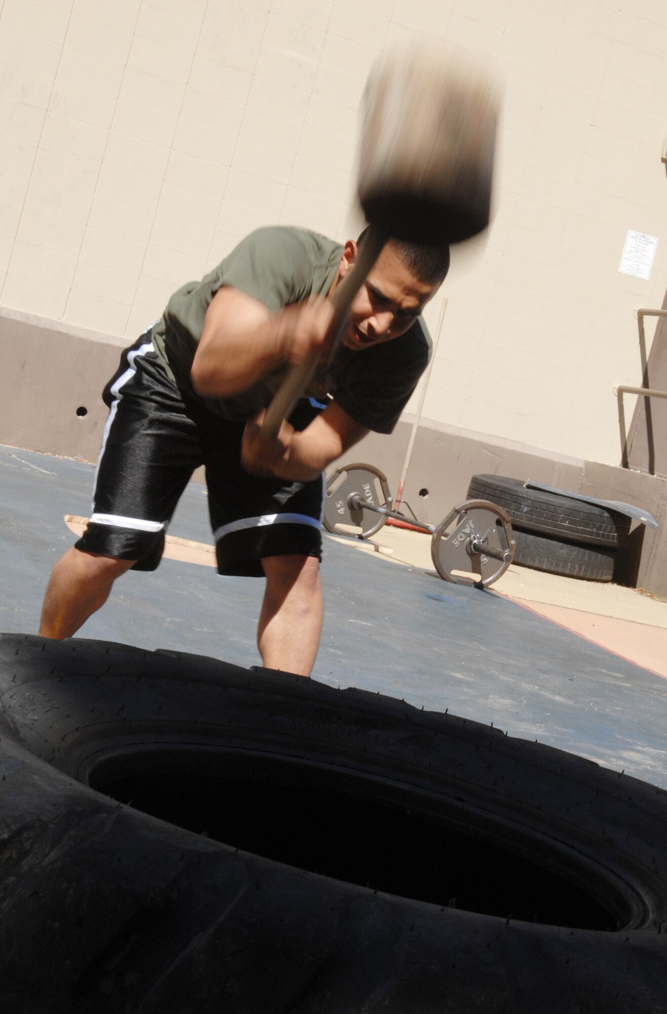 VANDENBERG AIR FORCE BASE, Calif. - Bringing down the hammer, Airman 1st Class Tim Prieto, of the 30th Security Forces Squadron, trains for Guardian Challenge at the old base gym here Tuesday, April 13, 2010. Security forces guardian challenge team members are selected by a physical fitness tryout and must possess outstanding shooting scores. (U.S. Air Force photo/Senior Airman Christopher Hubenthal)