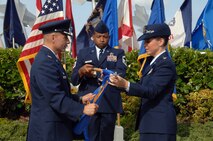 Col. Charles Baumgardner, 15th Mission Support Group commander (left), and Lt. Col. Carey Eichhorst, 15th Force Support Squadron commander, retire the 15th Mission Support Squadron guidon at the 15 FSS Assumption of Command ceremony here April 14. During the ceremony, the 15 MSS and the 15 SVS were deactivated and then re-activated jointly as the 15 FSS. (U.S. Air Force photo by Senior Airman Nathan Allen)