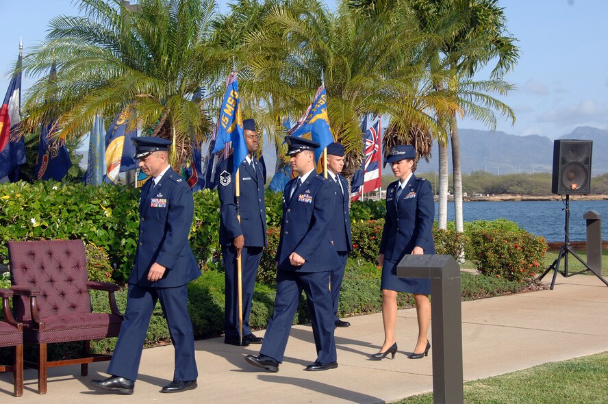 Col. Charles Baumgardner, 15th Mission Support Group commander (front), arrives with Lt. Col. Timothy Telega, former 15th Services Squadron commander, and Lt. Col. Carey Eichhorst, 15th Force Support Squadron commander as the official party at the 15 FSS Activation and Assumption of Command ceremony here April 14. During the ceremony, the 15th Mission Support Squadron and the 15 SVS were deactivated and then re-activated jointly as the 15 FSS. (U.S. Air Force photo by Senior Airman Nathan Allen)