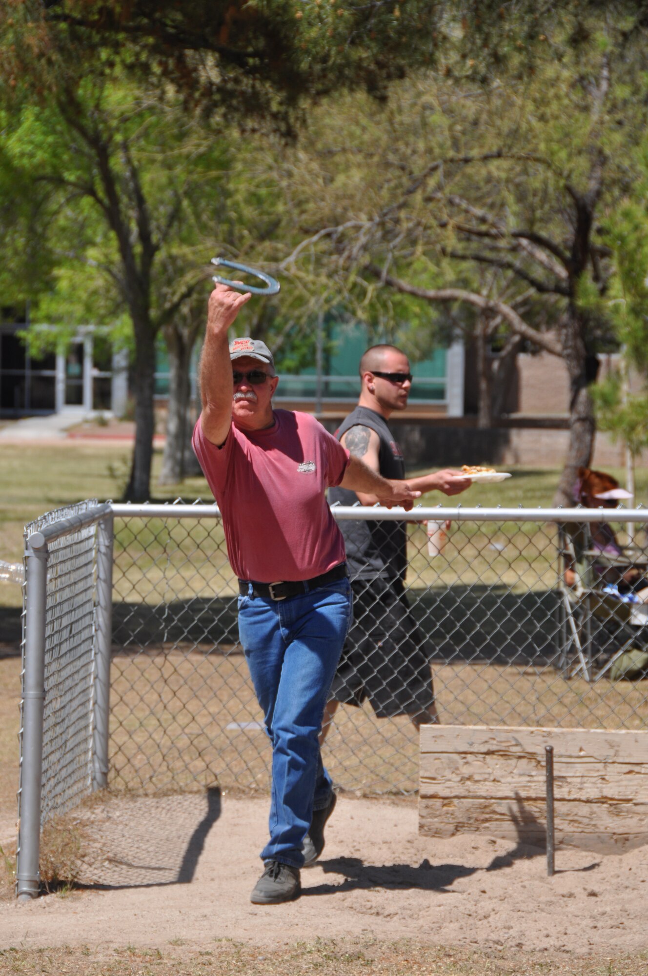 Senior Master Sgt.  Doug Stidvent tosses a horseshoe at Udall Park during the 162nd Fighter Wing’s annual picnic, April 11. (Air Force photo)