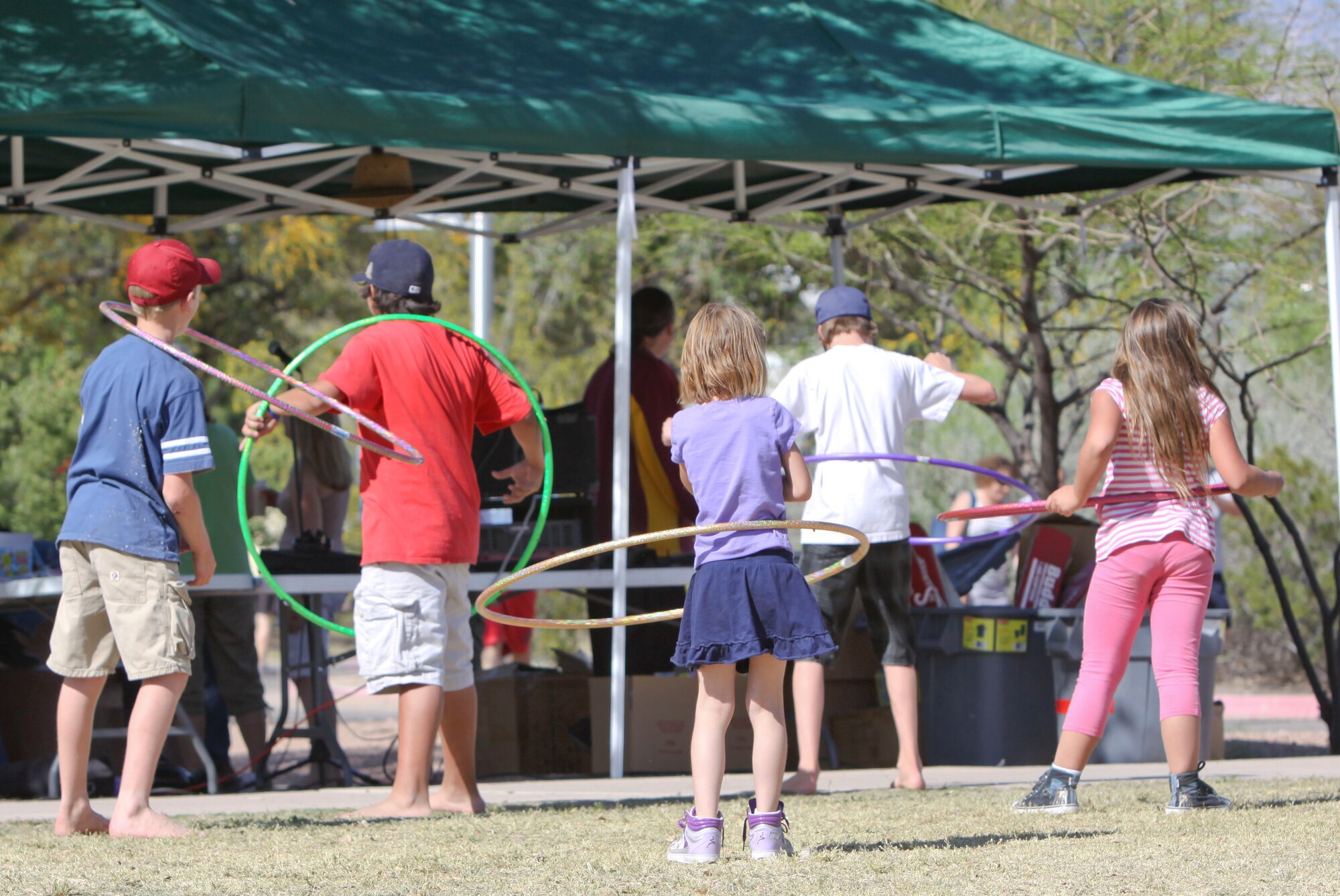 Children compete in a hula-hoop competition during the 162nd Fighter Wing annual picnic, April 11. (Air Force photo by Master Sgt. Hollie Hansen)