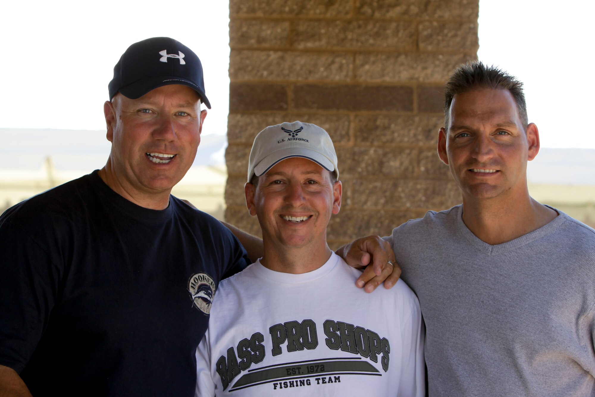 Senior Master Sgt. Brian Karas, Staff Sgt. Brent Thompson and 2nd Lt. James Barnett enjoy the shade during the 162nd Fighter Wing annual picnic at Udall Park April 11. (Air Force photo by Master Sgt. Hollie Hansen)
