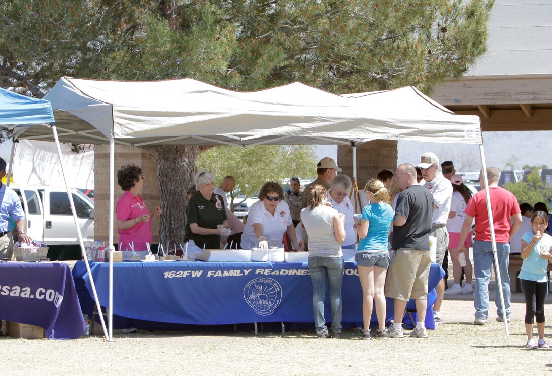 The 162nd Fighter Wing Family Readiness Group serves cake and ice cream with help from the American Veterans Ladies Auxiliary Post 770, April 11. (Air Force photo by Master Sgt. Hollie Hansen)