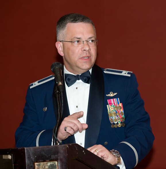 Col. Randal L. Bright, 512th Airlift Wing commander, congratulates the award winners during the 512th AW Annual Awards Banquet April 10 at the Sheraton in Dover. (U.S. Air Force photo/Jason Minto) 