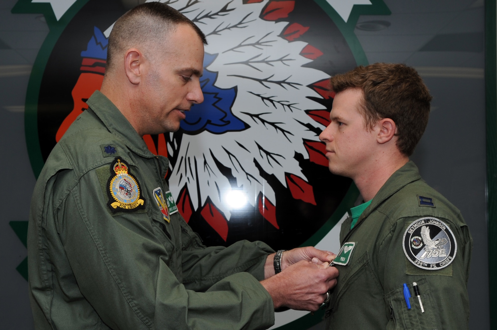 SEYMOUR JOHNSON AIR FORCE BASE, N.C. – Lt. Col. Christopher Anthony presents Capt. Aaron Dove with a Distinguished Flying Cross Medal here, April 9, 2010. Colonel Anthony is the 335th Fighter Squadron commander. Captain Dove, 335th FS weapon systems operator, hails from Hudson, Wis. (U.S. Air Force photo/Staff Sgt. Courtney Richardson)