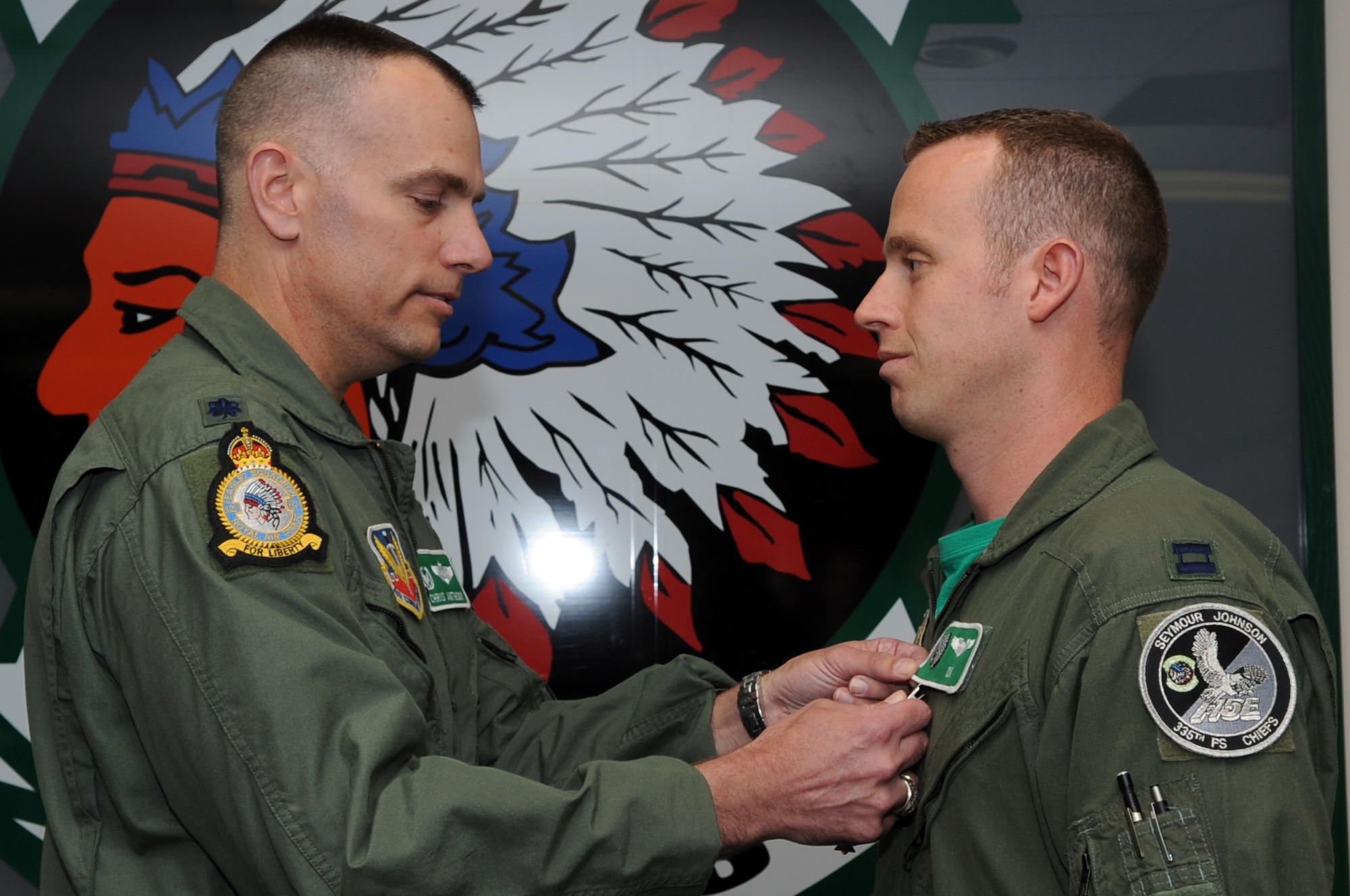 SEYMOUR JOHNSON AIR FORCE BASE, N.C. – Lt. Col. Christopher Anthony presents Capt. Mike Polidor with a Distinguished Flying Cross Medal here, April 9, 2010. Colonel Anthony is the 335th Fighter Squadron commander. Captain Polidor, 335th FS F-15E Strike Eagle pilot, hails from Pittsburgh, Pa. (U.S. Air Force photo/Staff Sgt. Courtney Richardson)