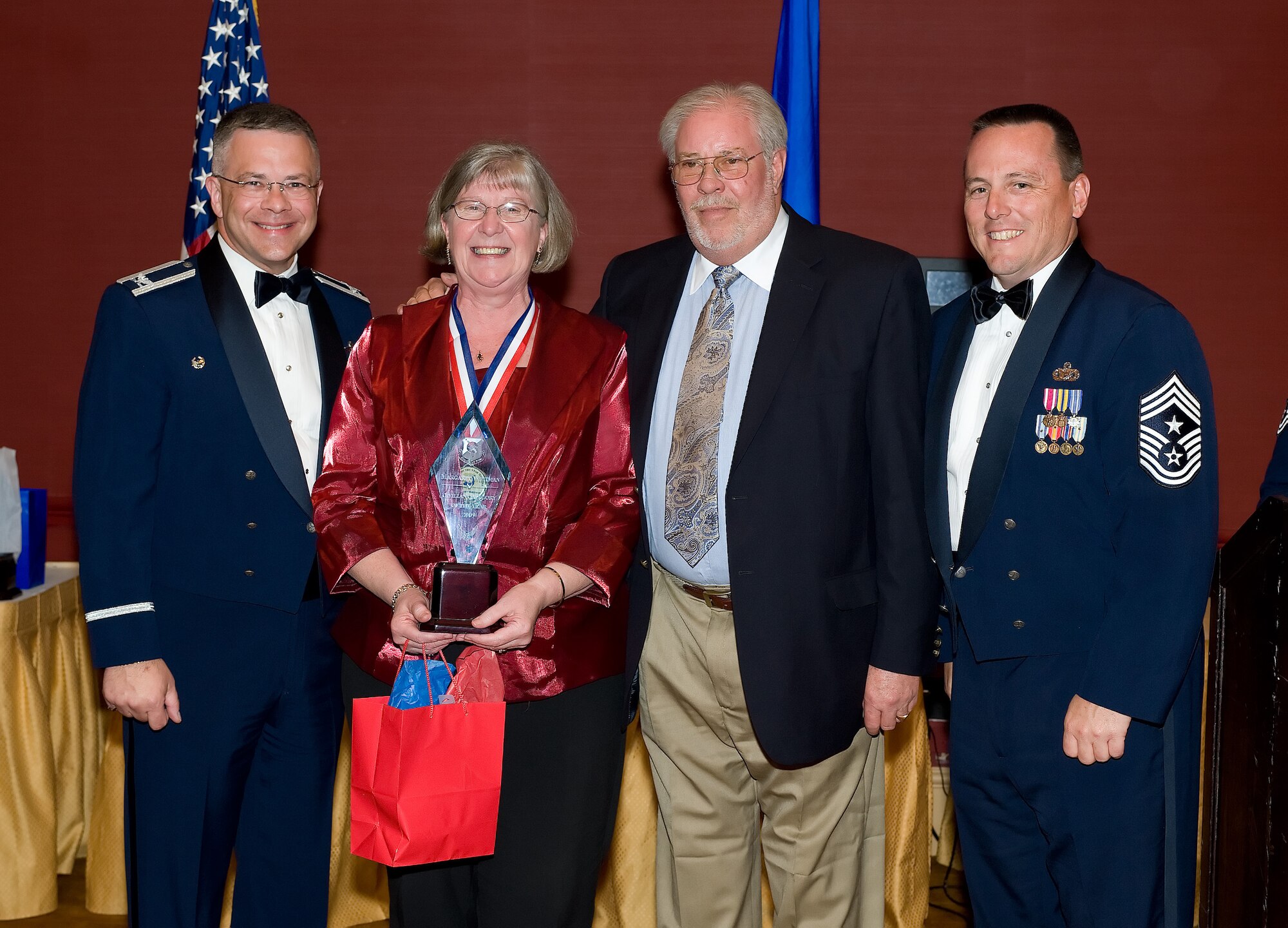 Margaret Whitman, 512th Airlift Wing Secretary, is the 2009 512th Airlift Wing Civlian of the Year. Her husband is Bill Whitman. Ms. Whitman was recognized for her accomplishments during the 512th AW Annual Awards Banquet April 10 at the Sheraton in Dover. (U.S. Air Force photo/Jason Minto) 