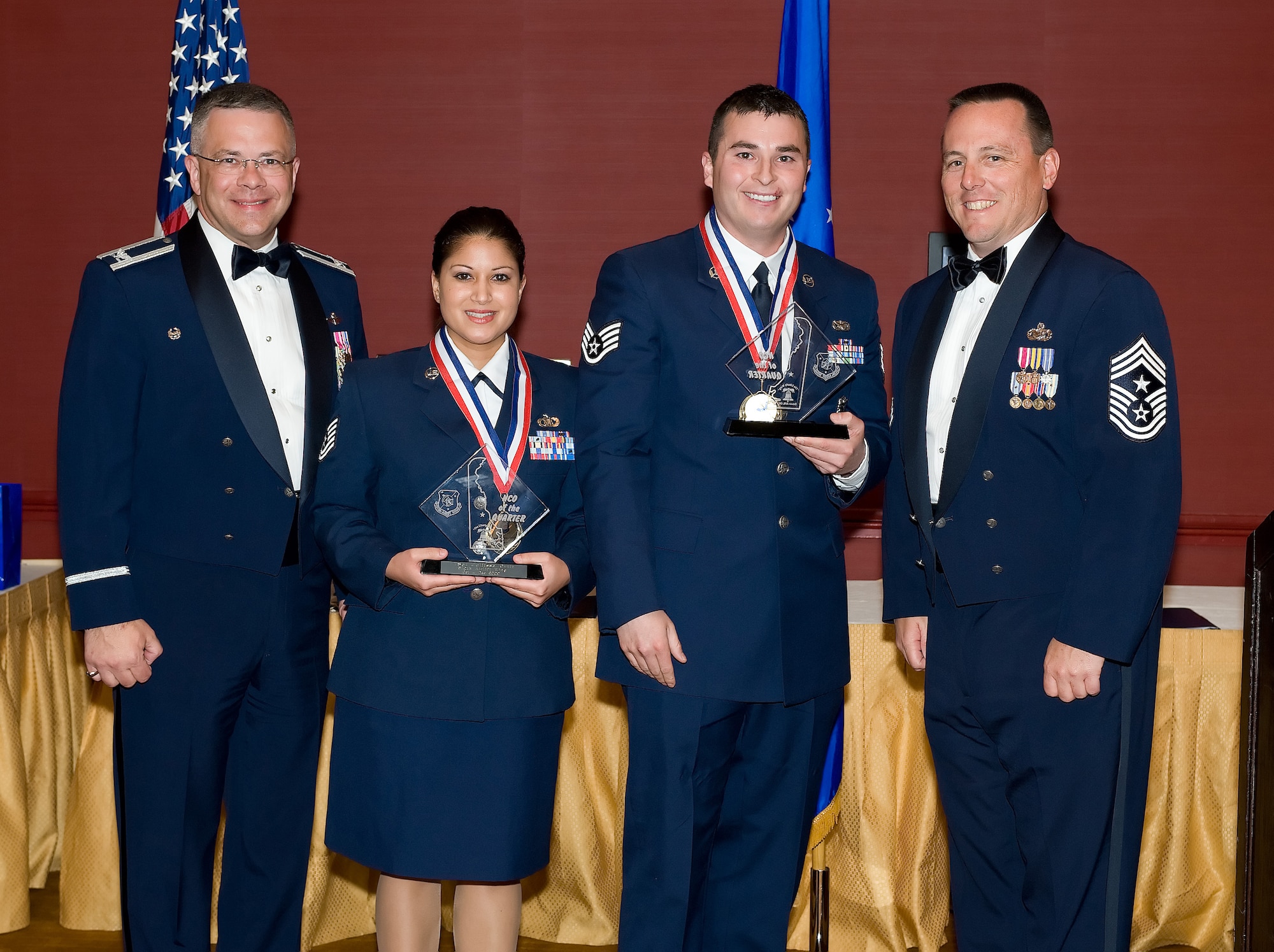 Tech. Sgt. Julitssa Ortiz, 512th Airlift Control Flight, and Staff Sgt. Nathaniel Rocha, 512th Security Forces Squadron, are the 2009 512th Airlift Wing NCOs of the fourth quarter. They were recognized for their accomplishments during the 512th AW Annual Awards Banquet April 10 at the Sheraton in Dover. (U.S. Air Force photo/Jason Minto) 