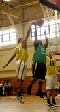 Players from the 628th Logistics Readiness Squadron and the 628th Comptroller Squadron leap for the ball during the intramural playoff games at the Fitness and Sports Center April 13, 2010, at Joint Base Charleston, S.C. The 628 CPTS defeated the 628 LRS 52-42. Coming into the match, 628 CPTS was seeded 9th place and the 628 LRS was seeded 8th place. (U.S. Air Force Photo/Airman 1st Class Lauren Main)