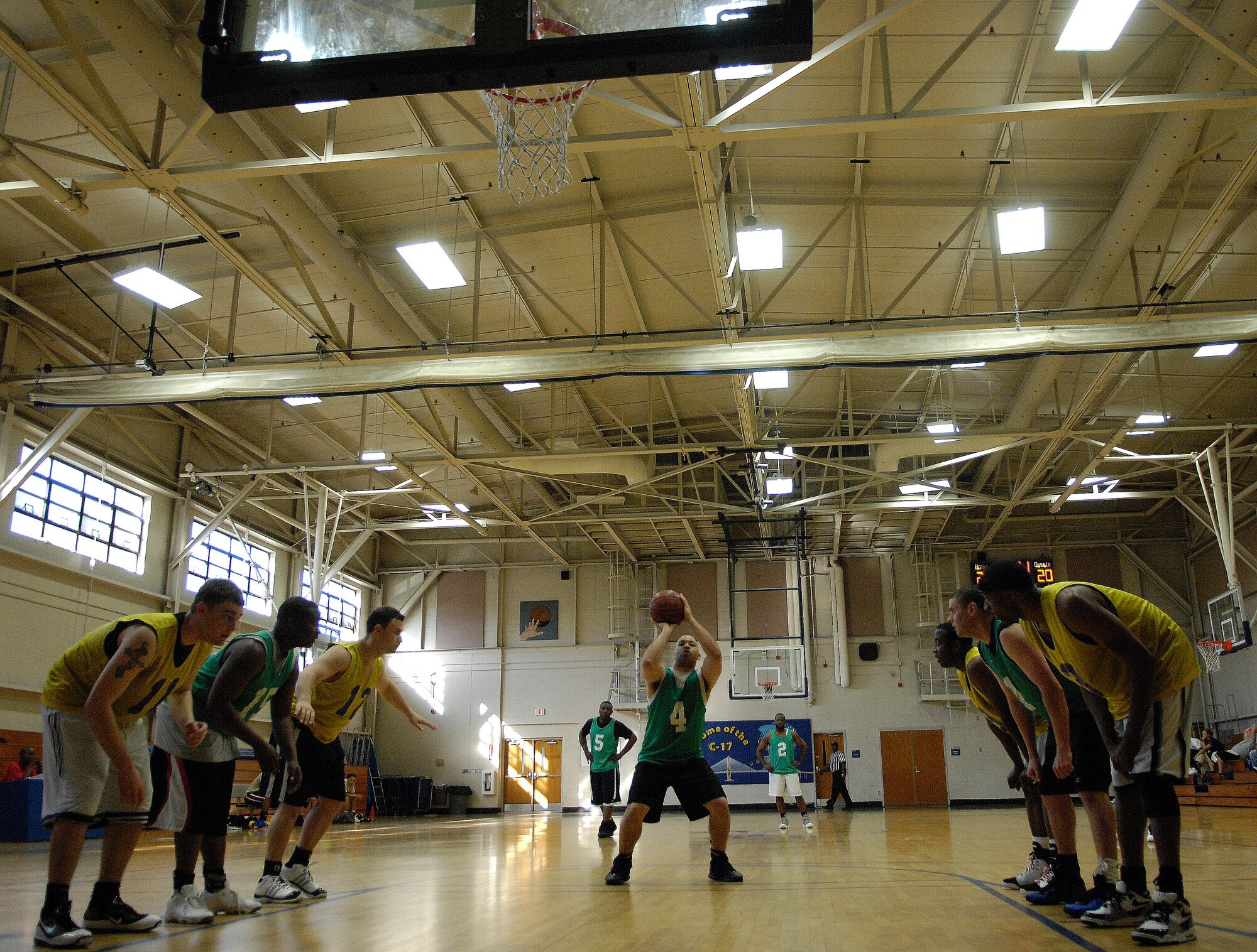 U.S. Air Force Staff Sgt. Adrian Johnson concentrates while attempting to make a shot during the intramural basketball game at Joint Base Charleston, S.C. April 13, 2010. Sixteen teams started off the playoffs for the base championship during this season, which will come to an end April 16. Sergeant Johnson is with the 628th Comptroller Squadron. (U.S. Air Force photo/Airman 1st Class Lauren Main)