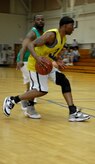 Fernando Whitten and Corkney Bishop fight for the ball during the intramural basketball playoff game at Joint Base Charleston, S.C. April 13, 2010. The 628th Comptroller Squadron defeated the 628th Logistics Readiness Squadron 52-42. Fernando Whitten is a financial analyst with the 628th Logistics Readiness Squadron. Mr Bishop is a dependent of Tech. Sgt. Nicole Bishop. (U.S. Air Force Photo/Airman 1st Class Lauren Main)