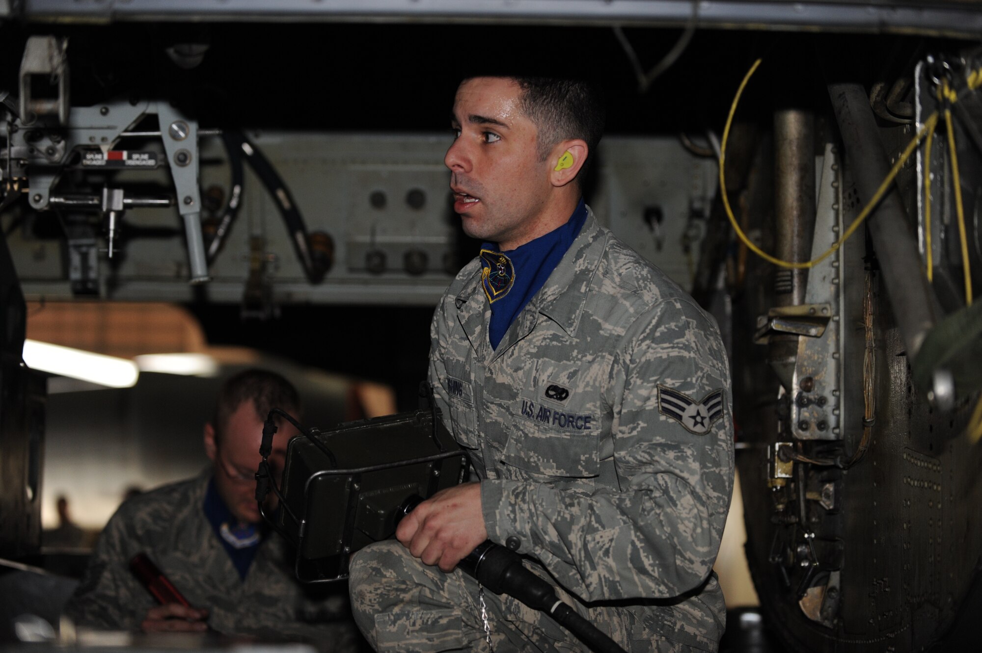 MINOT AIR FORCE BASE, N.D. -- Senior Airman Jesse Rushing, 5th Aircraft Maintenance Squadron load crew member, participates in a load crew competition April 13 here. The 5th Bomb Wing joined six other bomb wings in Air Force Global Strike Command’s first-ever load competition April 13 and 14 here. The evaluation was based not only on the Warbird’s hands-on skills, but also their knowledge in their respective career fields. (U.S. Air Force photo by Staff Sgt. Stacy Moless)