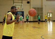 Marcus Fox prepares to catch a pass during an intramural basketball playoff game at Joint Base Charleston, S.C. April 13, 2010. The 628th Comptroller Squadron defeated the 628th Logistics Readiness Squadron 52-42. Marcus Fox is with the 628th Logistics Readiness Squadron. (U.S. Air Force Photo/Airman 1st Class Lauren Main)