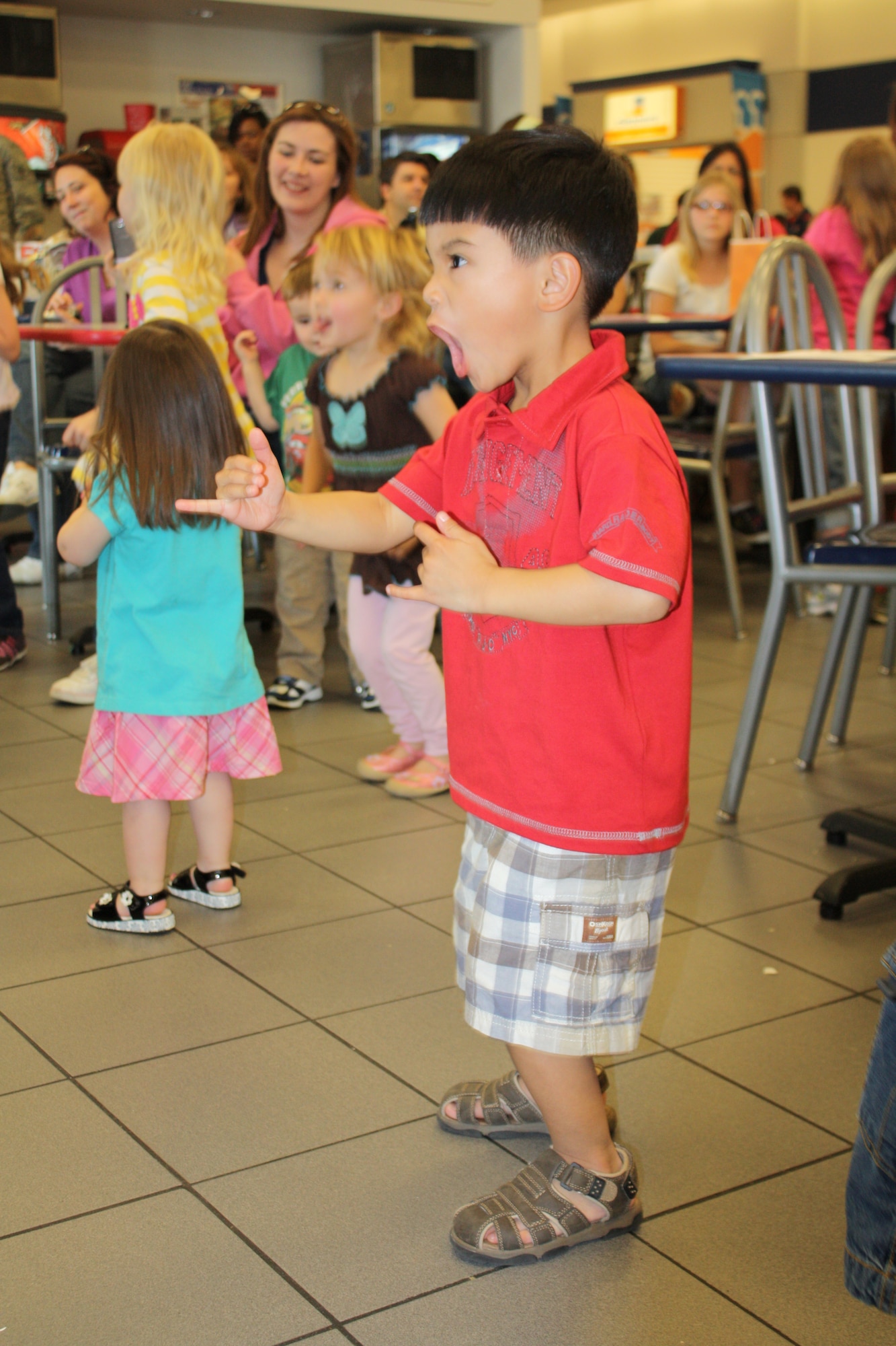 SCOTT AIR FORCE BASE, Ill. -- A young fan enjoys music by Ralph Covert Saturday at Scott.  Ralph is a children’s book author and singer/songwriter. Courtesy Photo