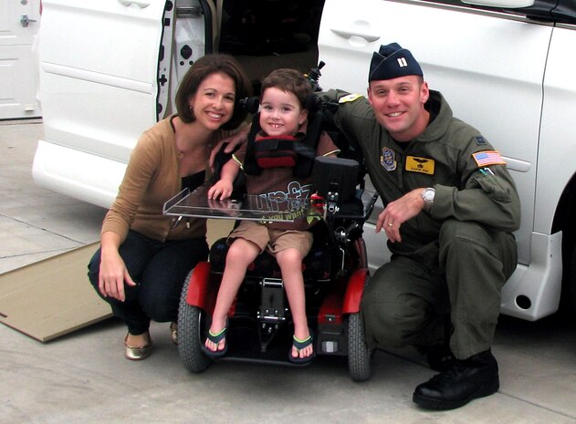 Capt. Aaron High, his wife Traci and son Max join for a photo outside their home on his third birthday. At 10 months old, Max was diagnosed with spinal muscular atrophy. Now going on 4, he and his family take each day at a time to cope with the effects of the rare, genetic neuromuscular disease. The family chronicles progress on their Web site at www.hopeformax.com. (Courtesy photo)