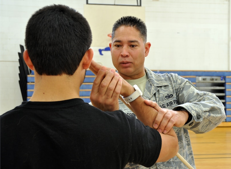 419th Fighter Wing recruiter, Tech. Sergeant Richard Isaacson, helps a new recruit fine tune a salute during a Delayed Enlistment Program event here April 10. The wing's recruiters regularly host DEP events for new Airmen who are awaiting departure to Basic Military Training. DEP events give the new recruits a taste of Air Force customs and courtesies and build camaraderie. (U.S. Air Force photo/Staff Sgt. Heather Skinkle)