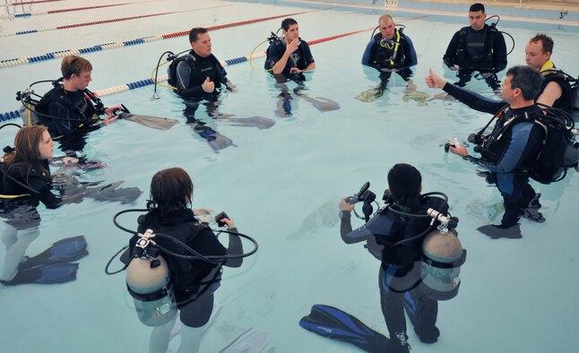 Robert Hyde, Eglin Dive Flight instructor, goes over procedures at the beginning of Day 2 of the certification course taught here at Eglin.  The class is four days over two weekends and it occurs once a month.  After taking the course, students will be certified to dive in up to 60 feet of water.  Anyone interested in attending the class, can call 850-217-1261.  (U.S. Air Force photo/Samuel King Jr.)