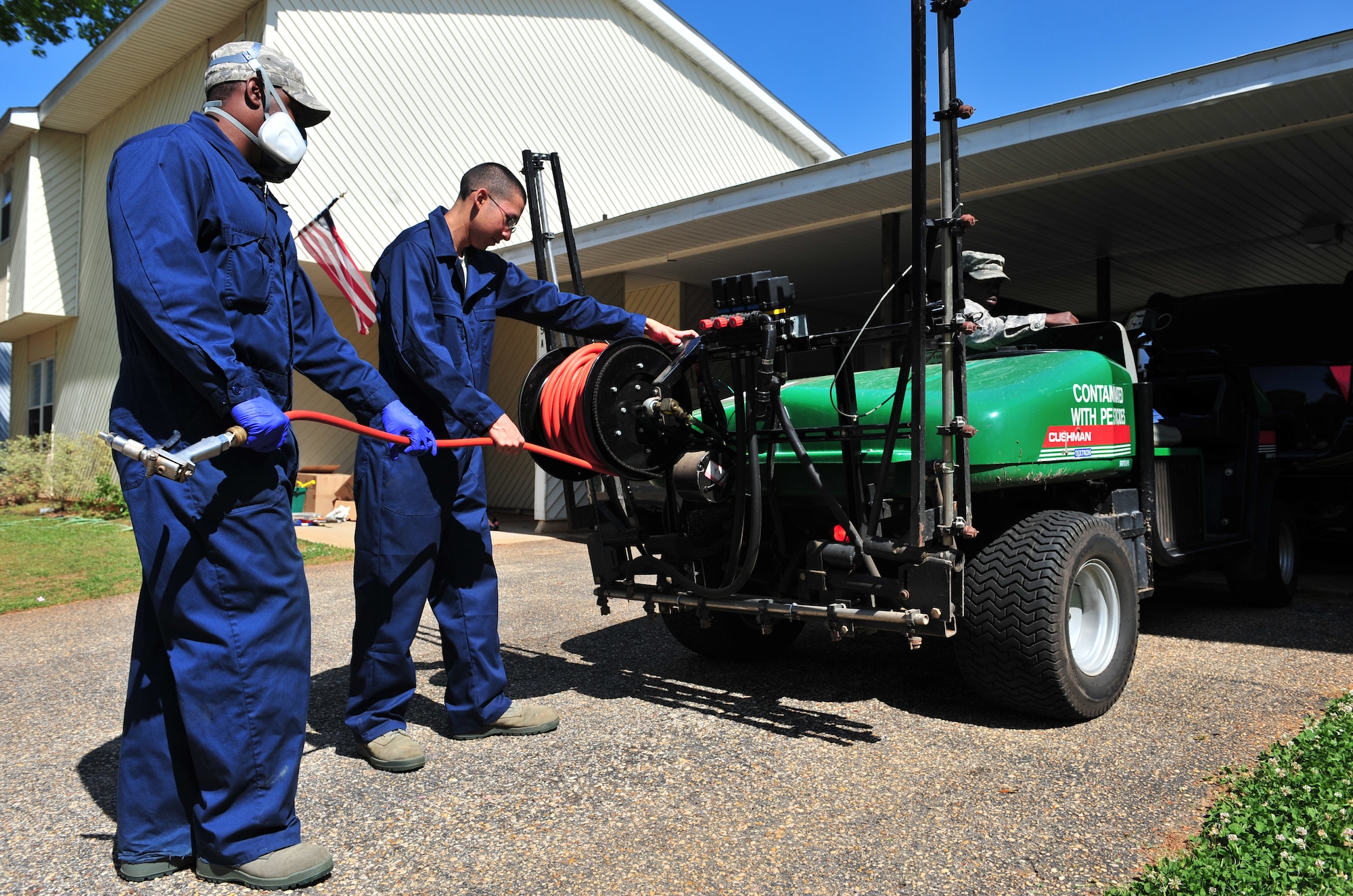 100412-F-8430J-157
SHAW AIR FORCE BASE, S.C. - Senior Airman Terrence Murray and Airman Alvaro Koo, 20th Civil Engineer Squadron entomologists, roll up a hose used to spray pesticides April 12, 2010. The 20th CES entomologists specialize in pest control, eliminating weeds, and conducting health inspections. The 20th CES entomologists are vital to the Air Force since they are in charge of diseases and pest control so troops and families can stay healthy.  (U.S. Air Force photo/Airman 1st Class Amber E. N. Jacobs)