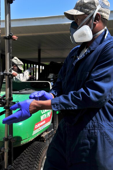 100412-F-8430J-114
SHAW AIR FORCE BASE, S.C. - Senior Airman Terrence Murray, 20th Civil Engineer Squadron entomologist, puts on protective gear before spraying pesticides around a base home April 12, 2010. The 20th CES entomologists specialize in pest control, eliminating weeds, and conducting health inspections. The 20th CES entomologists are vital to the Air Force since they are in charge of diseases and pest control so troops and families can stay healthy.  (U.S. Air Force photo/Airman 1st Class Amber E. N. Jacobs)