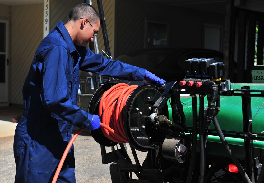 100412-F-8430J-098
SHAW AIR FORCE BASE, S.C. - Airman Alvaro Koo, 20th Civil Engineer Squadron entomologist, roll up a hose used to spray pesticides April 12, 2010. The 20th CES entomologists specialize in pest control, eliminating weeds, and conducting health inspections. The 20th CES entomologists are vital to the Air Force since they are in charge of diseases and pest control so troops and families can stay healthy.  (U.S. Air Force photo/Airman 1st Class Amber E. N. Jacobs)
