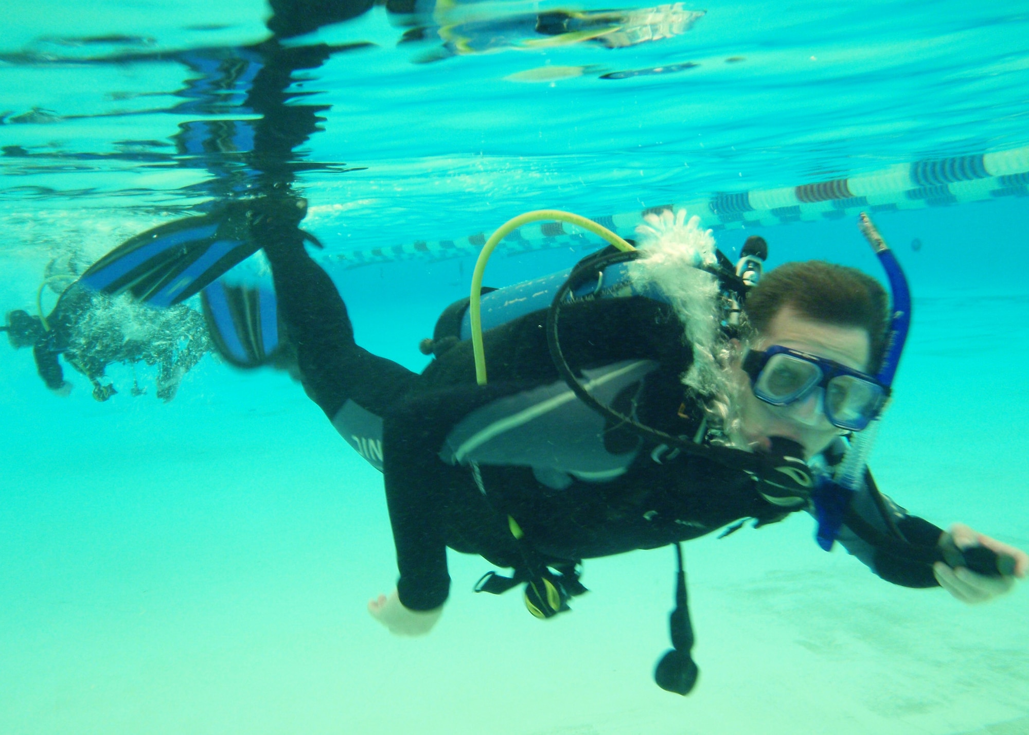 Ken Sharp, 681st Armament Systems Squadron, swims underwater in full scuba gear for the first time during Day 2 of the certification course taught here at Eglin.  He and his three children took the dive flight’s certification class together.  The class is four days over two weekends and it occurs once a month.  After taking the course, students will be certified to dive in up to 60 feet of water.  Anyone interested in attending the class, can call 850-217-1261.  (U.S. Air Force photo/Samuel King Jr.)