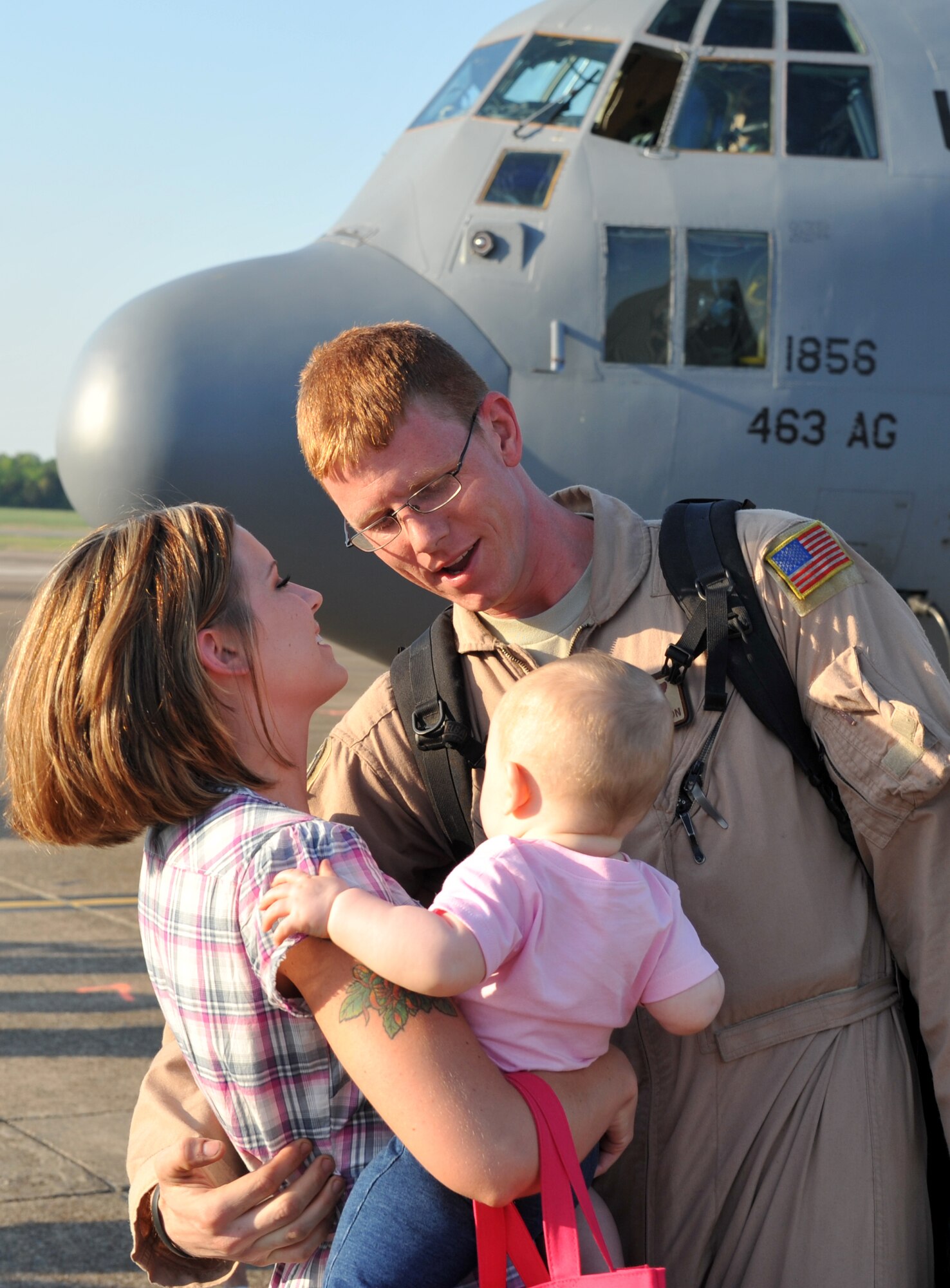 Airman 1st Class William Hamilton, 61st Airlift Squadron, receives a warm welcome from his family on the Little Rock Air Force Base flight line. Airman Hamilton was part of a group of 61st AS members that returned home after a four-month deployment.  (U.S. Air Force photo by Senior Airman Chris Willis)