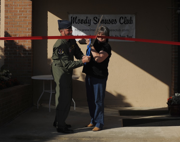MOODY AIR FORCE BASE, Ga. -- Col. William DeMaso, 23rd Wing vice commander, cuts the ribbon with Laura Dunning, Thrift Shop manager, during the Thrift Shop reopening ceremony here April 13. The shop allows Airmen to purchase consigned or donated goods at an inexpensive price. (U.S. Air Force photo by Airman 1st Class Benjamin Wiseman/RELEASED)