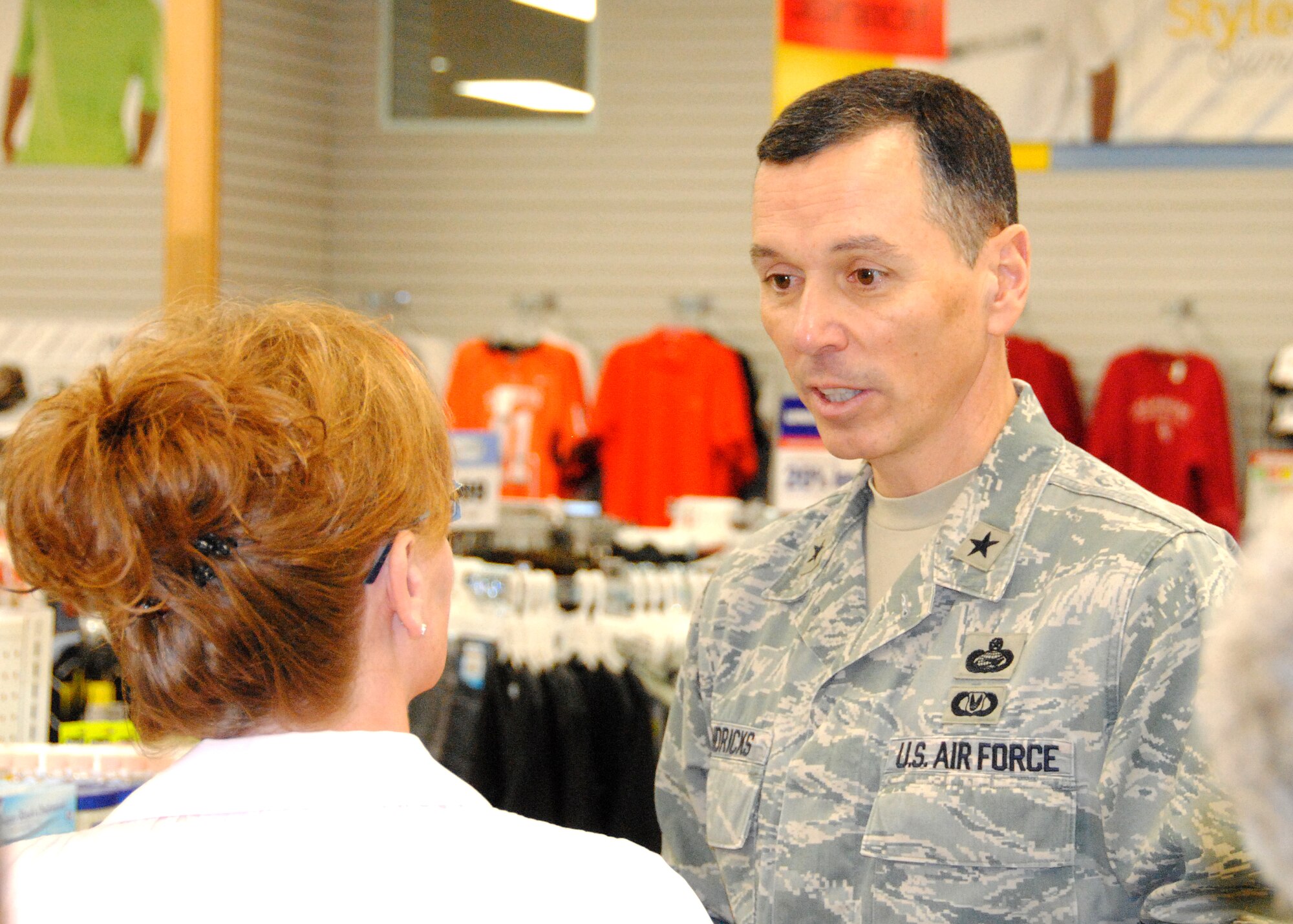 Brig. Gen. Francis Hendricks, deputy commander of the Army Air Force Exchange Service, right, talks about product selection and floor displays with Jami Gregory, the Vance Base Exchange store manager, during the general's visit to Vance AFB on April 9. (U.S. Air Force photo/ Joe B. Wiles)