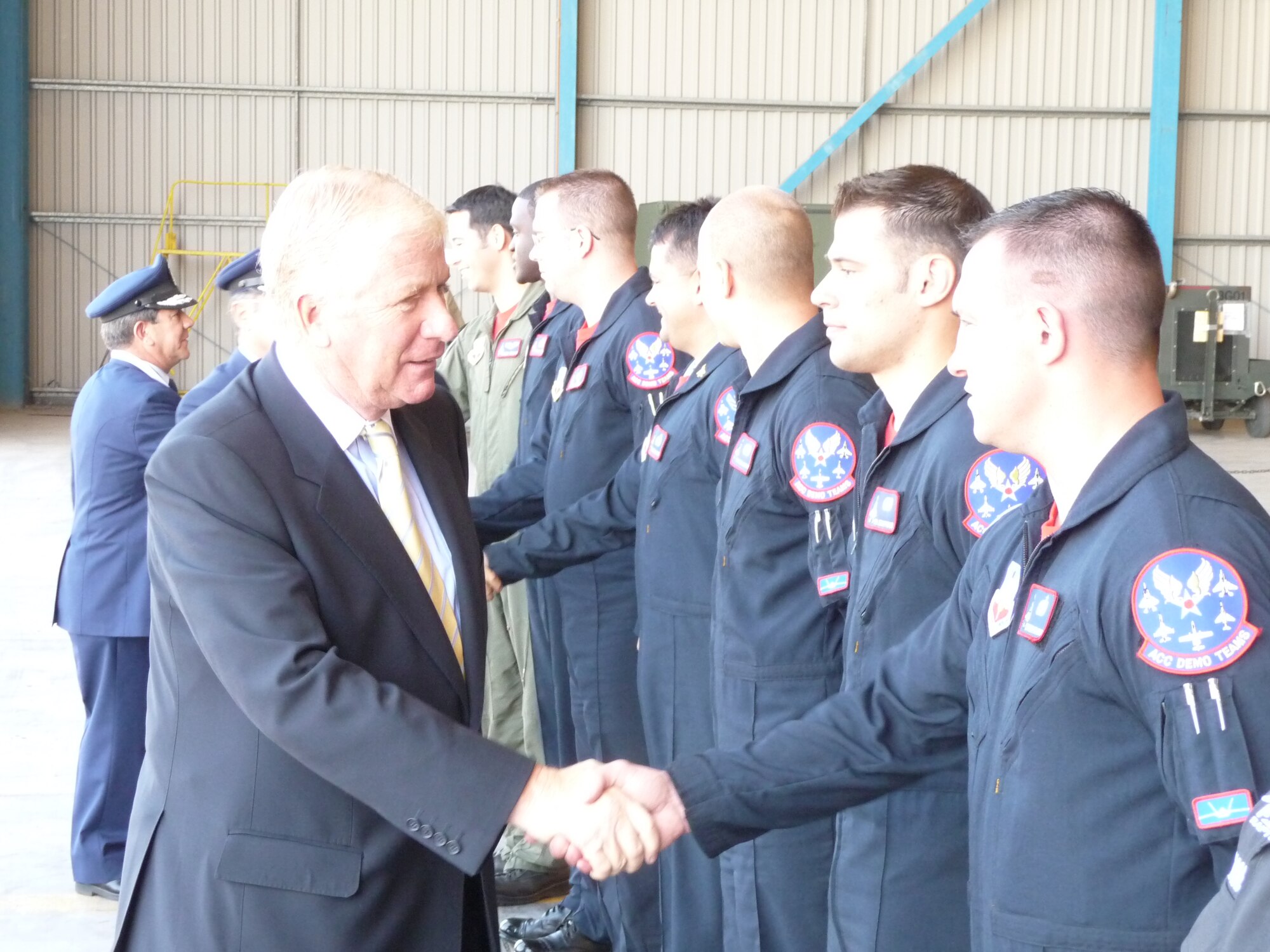 SANTIAGO, Chile -- Mr. Jaime Ravinet de la Fuente, the Chilean Minister of Defense, greets members of the Air Combat Command F-22 Raptor Demonstration
Team in Santiago, Chile, during the FIDAE Air and Trade Show. Mr. Ravinet de la Fuente thanked the Demonstration Team for their community outreach efforts during the international event and praised the cooperation between Airmen of the U.S. and Chilean Air Forces.  During the week between Raptor demonstration flights, Airmen met with local community leaders, hosted children from various charitable organizations and visited a hospital for ill children . 
