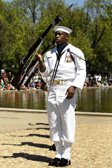 Members of the U.S. Navy Honor Guard Drill Team perform during the 3rd Annual Joint Service Drill Team Exhibition April 10 at the Lincoln Memorial in Washington, D.C. The event featured drill team performances from all five military branches. (U.S. Air Force photo by Staff Sgt. Dan DeCook)