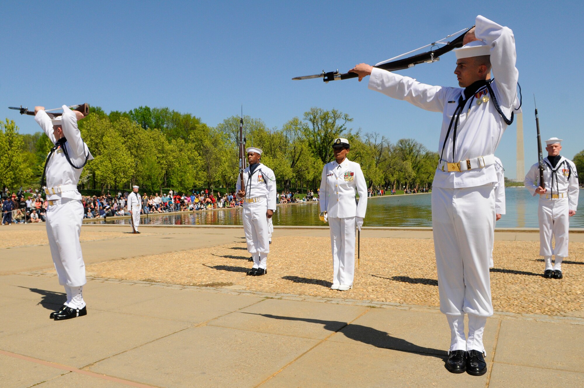 Members of the U.S. Navy Honor Guard Drill Team perform during the 3rd Annual Joint Service Drill Team Exhibition April 10 at the Lincoln Memorial in Washington, D.C. The event featured drill team performances from all five military branches. (U.S. Air Force photo by Staff Sgt. Dan DeCook)
